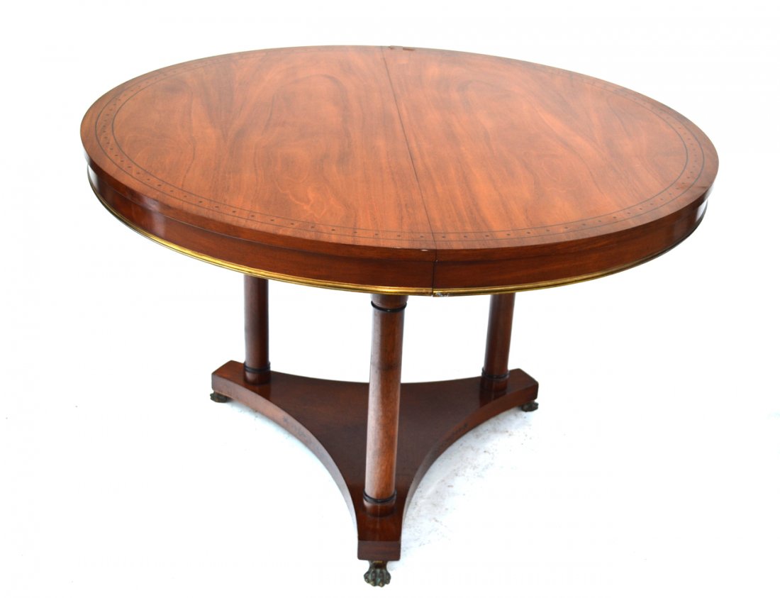 Mahogany Dining Room Table (2 leaves): Mahogany single pedestal, banded - decorated dining room table with two leaves. In good condition. [46" L (closed) x 46" D x 30" H]. Two leaves [18" each].