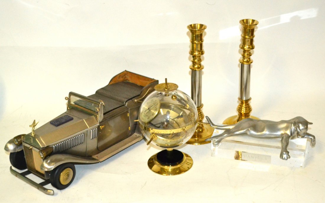 Assorted Decorative Objects: Comprises: 1.) Hugar Sputnik style modern barometer [8"H]. 2.) Pair of brass and nickel finish candlesticks. 3.) Aluminum panther sculpture [9 3/4"L]. 4.) Men's Rolls Royce steel jewelry/music box [16