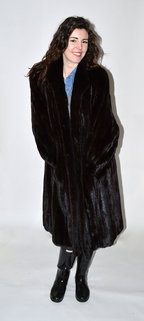 Ladies' 3/4 Length Fur Coat: Women's size 8 to 10. Bears two exterior and one interior pocket. Features label: "Furs by Steven / New York". In good condition.