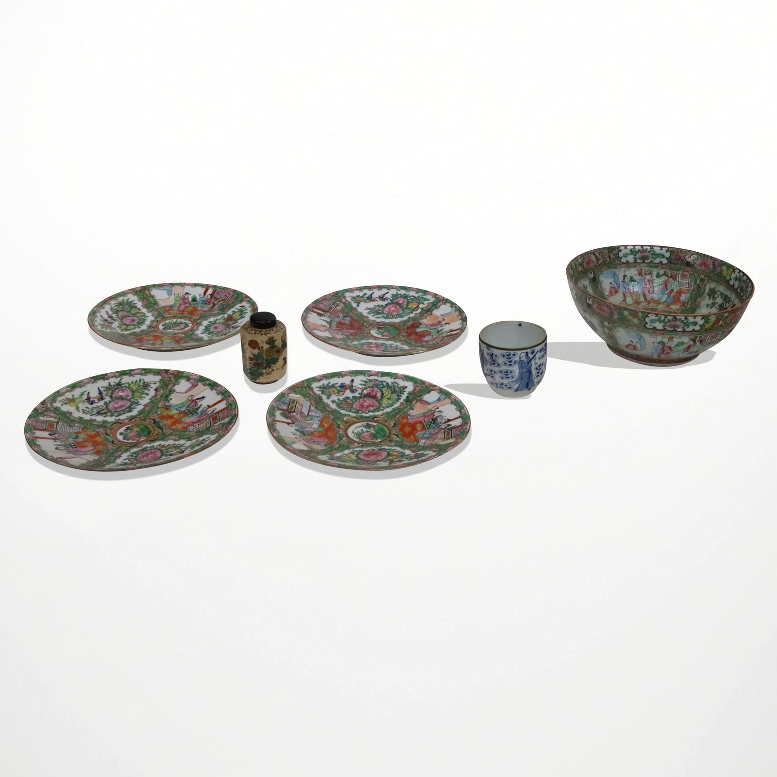 Seven Chinese Porcelain Articles: Seven Chinese porcelain articles, Famile verte bowl [4" H x 11" diameter, set of four famille verte plates made in China [10" diameter], blue and white cup, and a small tea caddy with wooden cover. Al