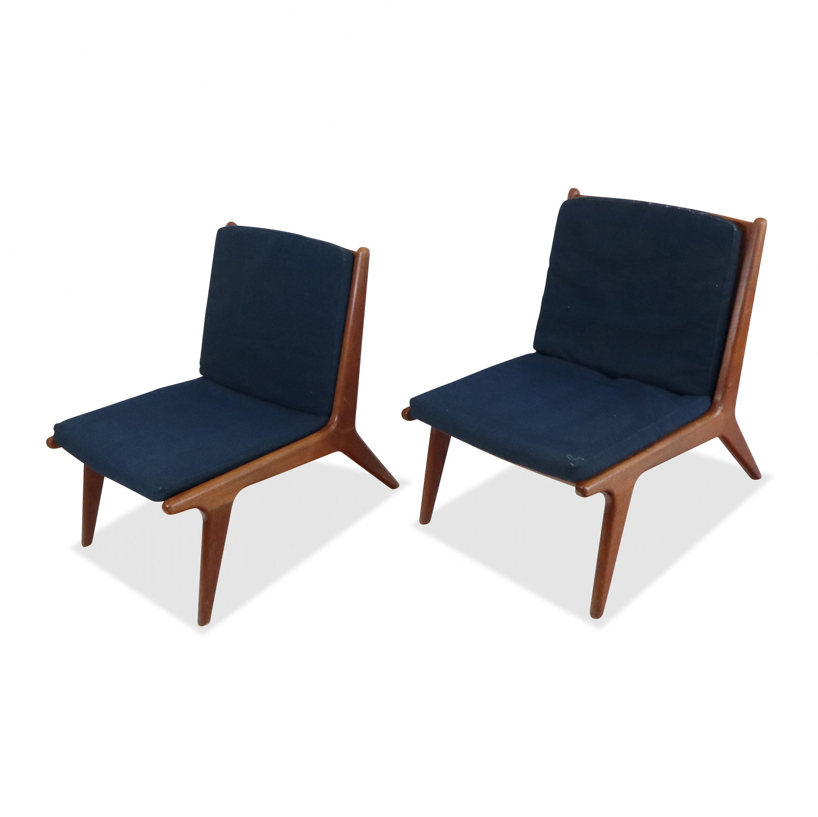 Pair of Mid-Century Low Slipper Chairs: Pair mid-century walnut low slipper side chairs, American, mid 20th century, After John Stuart, with slat backs, blue cushion backs and seats. [28" H x 24" W x 29" D]. Good condition, no issues