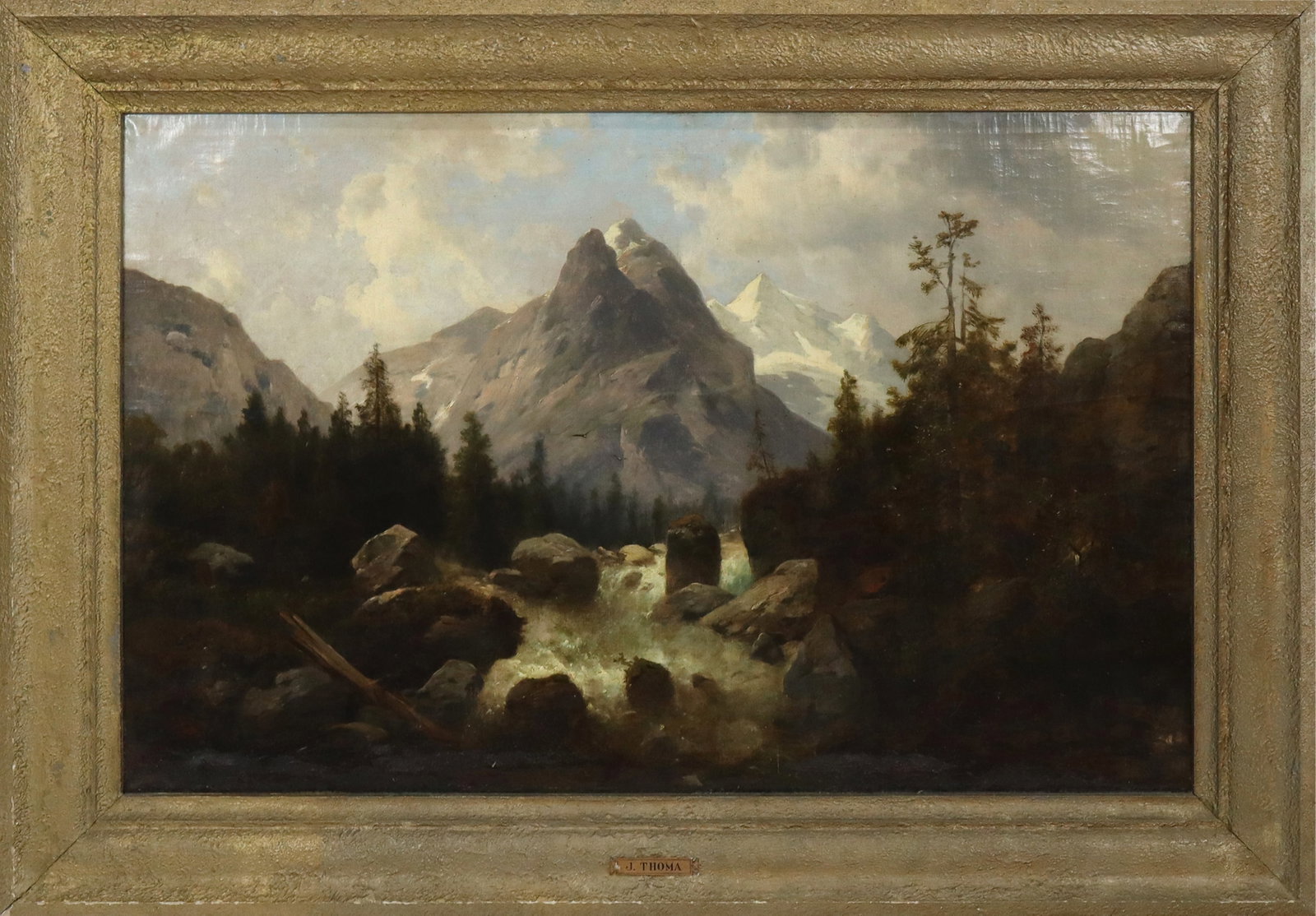 Josef THOMA Oil on Canvas: Josef Thoma (Austrian 1828-1899), oil on canvas, Alpine landscape with river and trees in front of a mountain. [Canvas 26" H x 41" W; frame 35" H x 50" W]. Fair condition, lower part of canvas