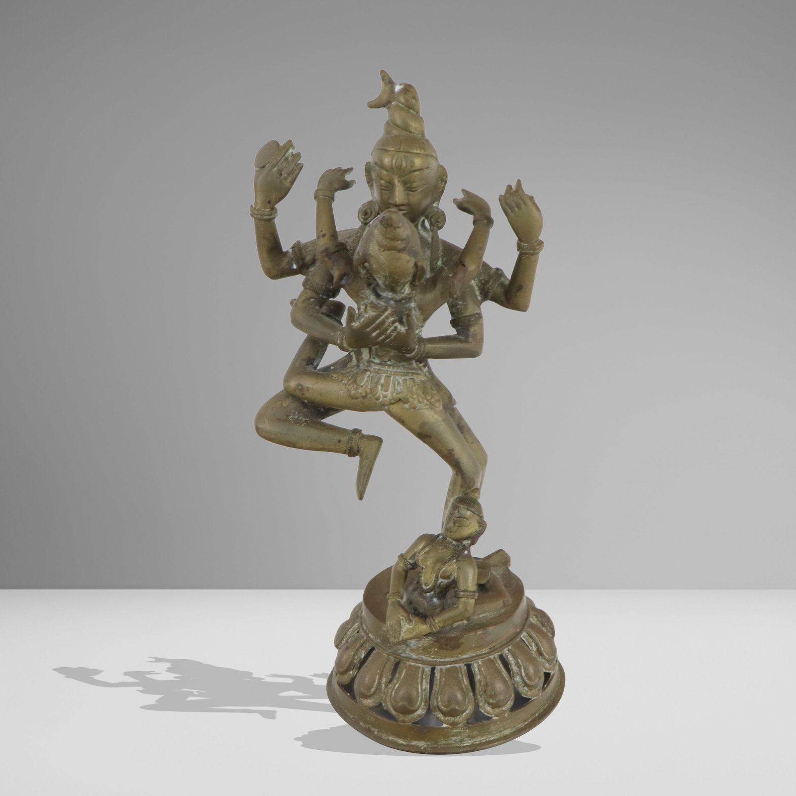 Indian Brass Deity Dancing Group: Indian brass deity dancing group, One tall figure dancing with a second figure and a third in front, on round lotus base. [14" H x 7" diameter]. Good condition, slightly bending.