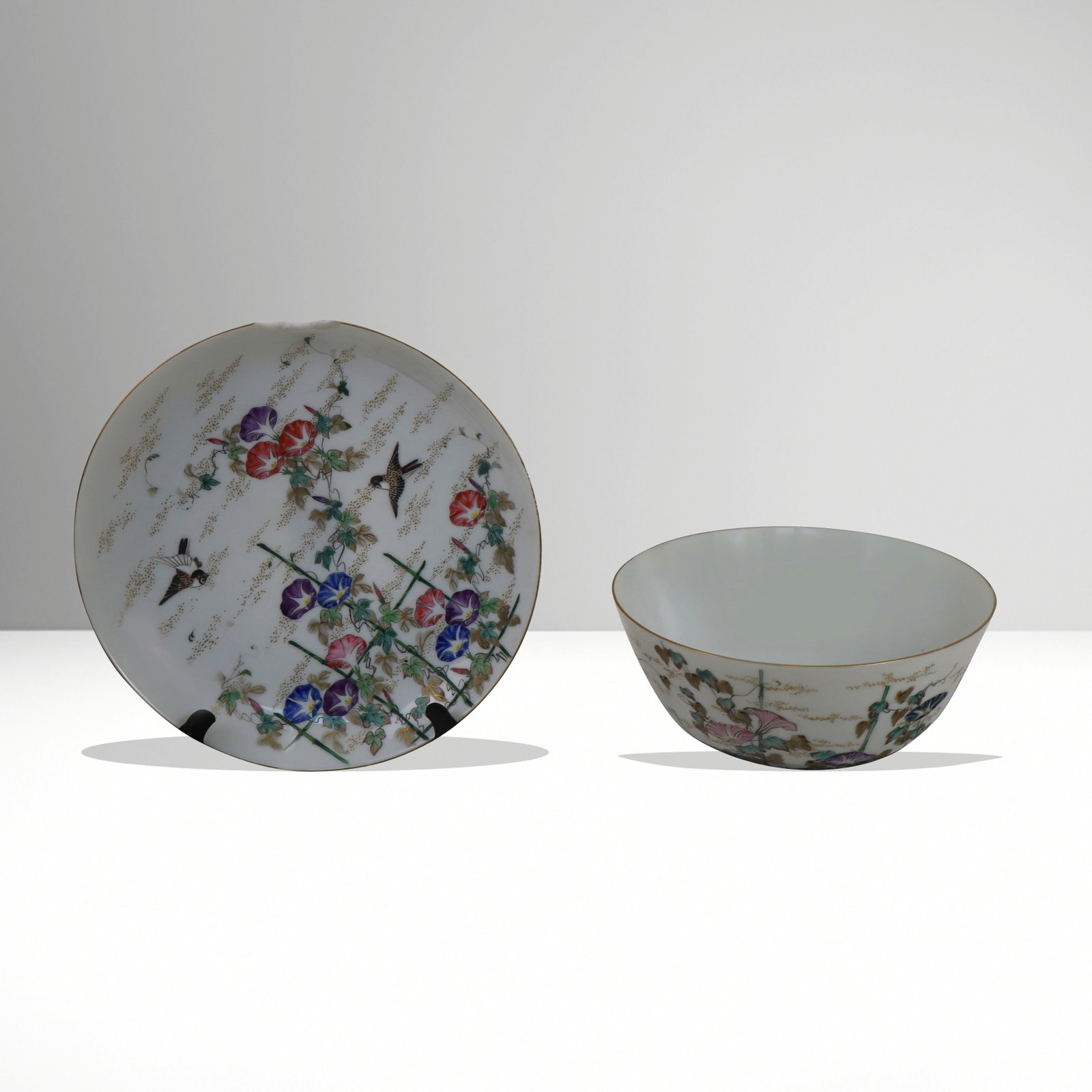 Chinese Porcelain Bowl and Plate: Chinese porcelain bowl and plate; exterior painted designs of bamboo and flowering vines and bird. Each signed on bottom. [Bowl 3.5" H x 7 diameter; plate 9" diameter]. Bowl fine. Plate with large
