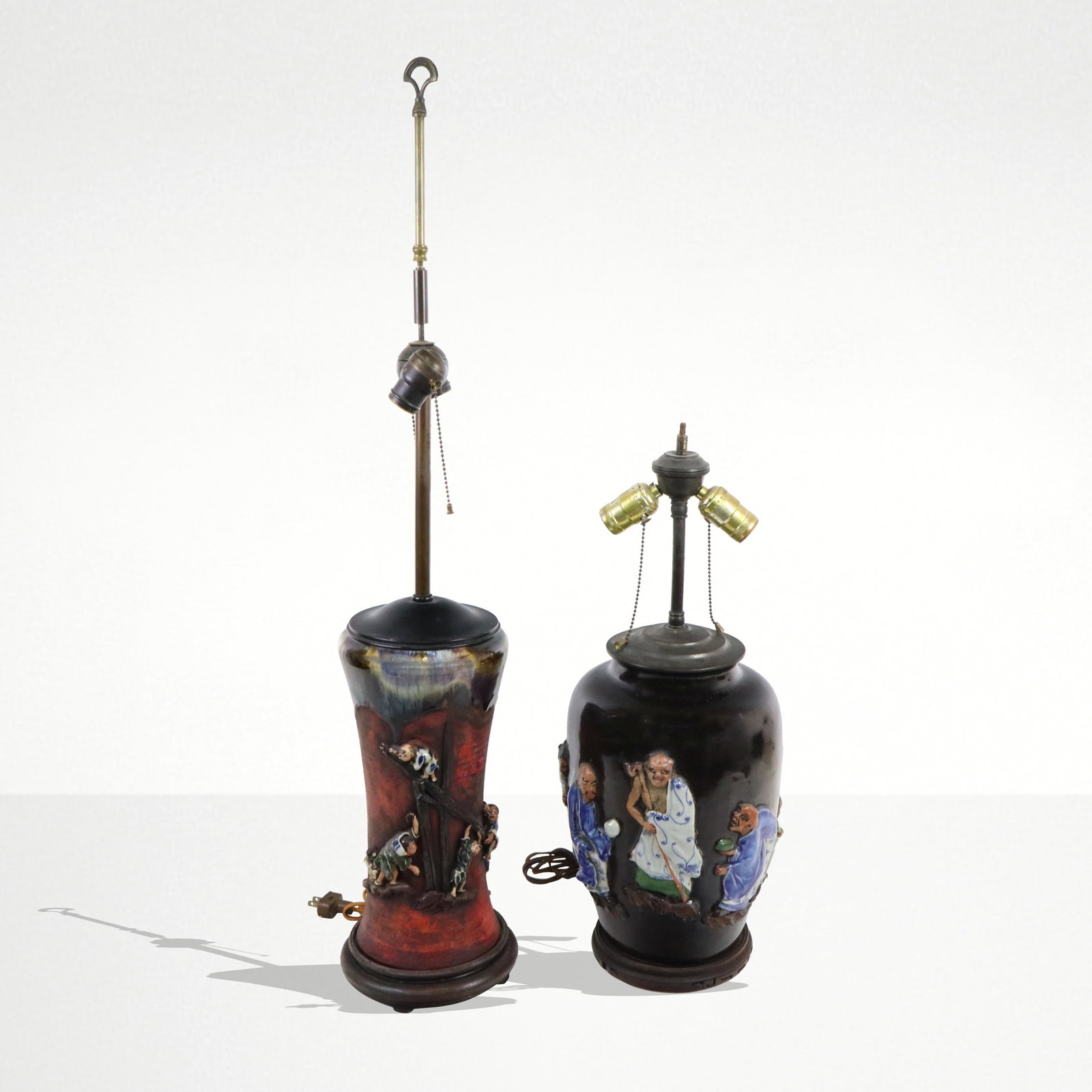 Two Chinese Mudware Vase Lamps: Two Chinese mudware vase lamps, one with mounted wise men figures and mounted signature, one tapered in dark and red with small climbing figures and mounted signature. [Larger Vase 13" H, lamps