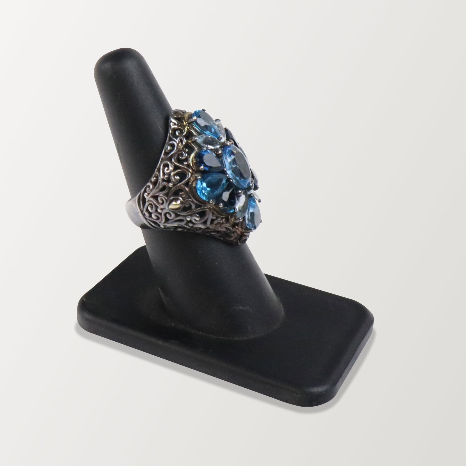 Robert Manse Silver, Gold and Topaz Ring: Robert Manse sterling silver, 18K yellow gold and topaz ring, of "Bali" design, the interior with pierced grillwork, marked M ID 925 18K on the interior shank. [8.35 dwt.; size 7]. Overall condition i