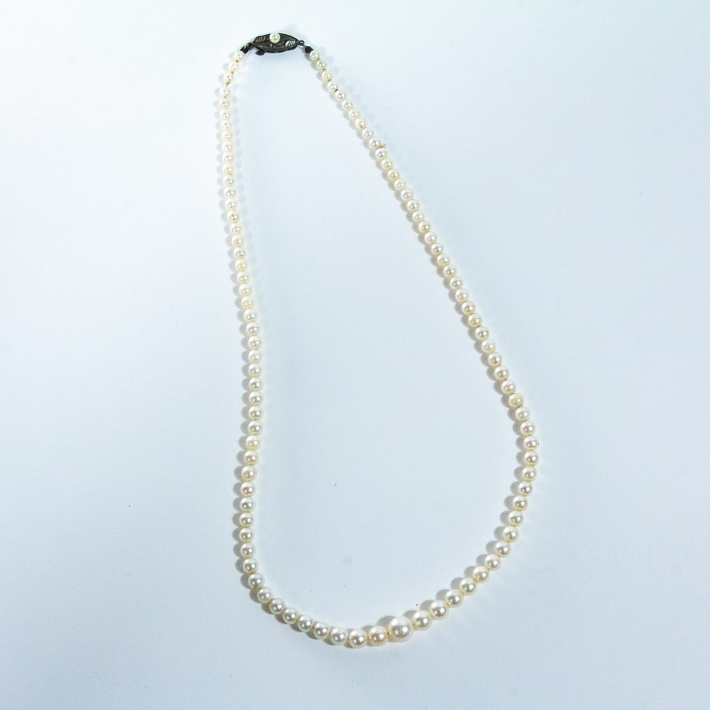 Group of Cultured Pearl Jewelry, 4: Group of cultured pearl jewelry, comprising pair of pearl and 14K white gold earrings; a pearl necklace, ranging 5.5 - 6mm and joined by silver and pearl clasp [14.5" L], and a pearl necklace, ranging