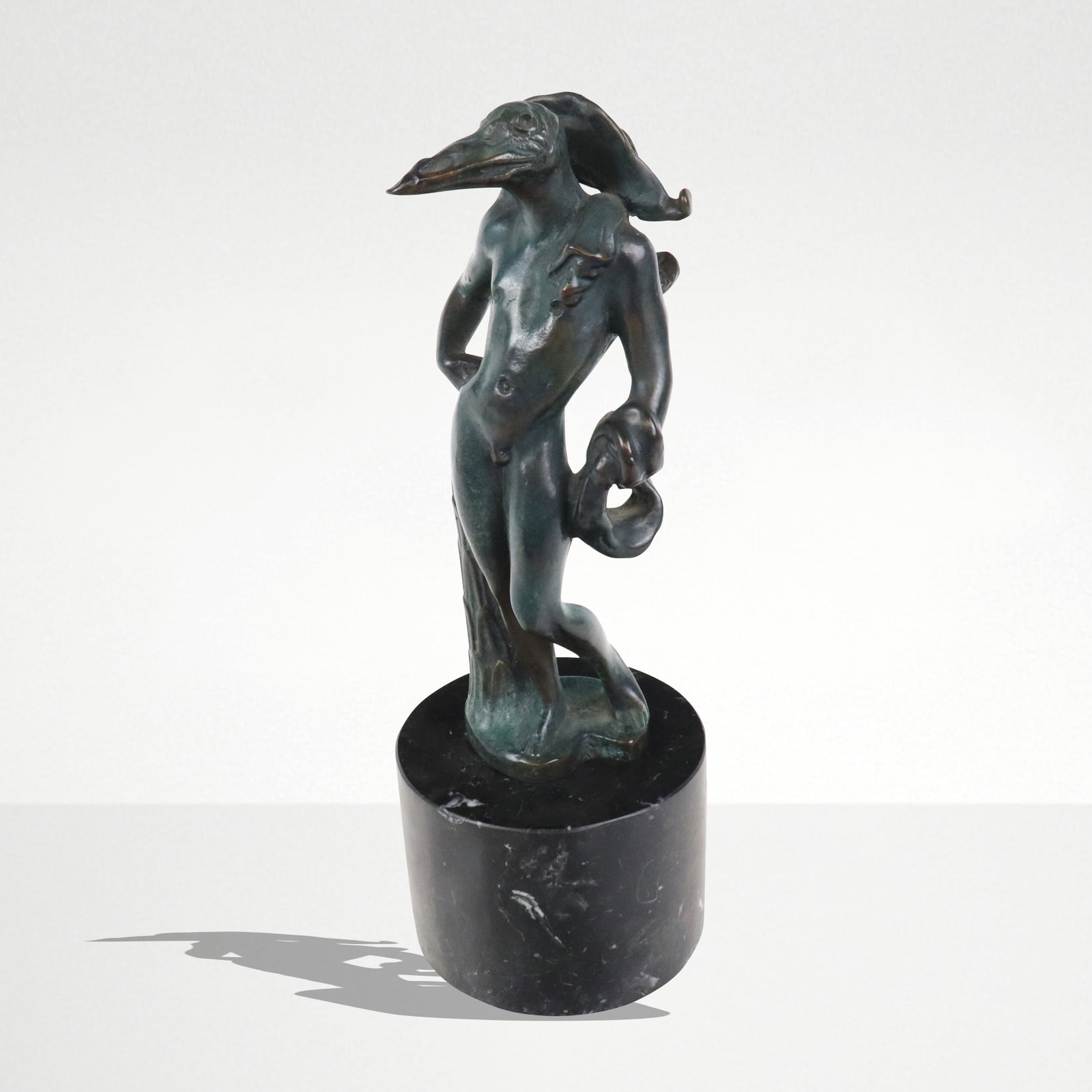Salvador DALI "L'homme oiseau" (Birdman) Bronze Sc: Salvador Dali (Spanish, 1904-1989) "L'homme oiseau" bronze on marble, signed Dali H.C. with Rudier Fond Paris mark to lower back. [Figure: 8" H x 3.5" Diameter; Base: 3" H x 4" Diameter]. Condition