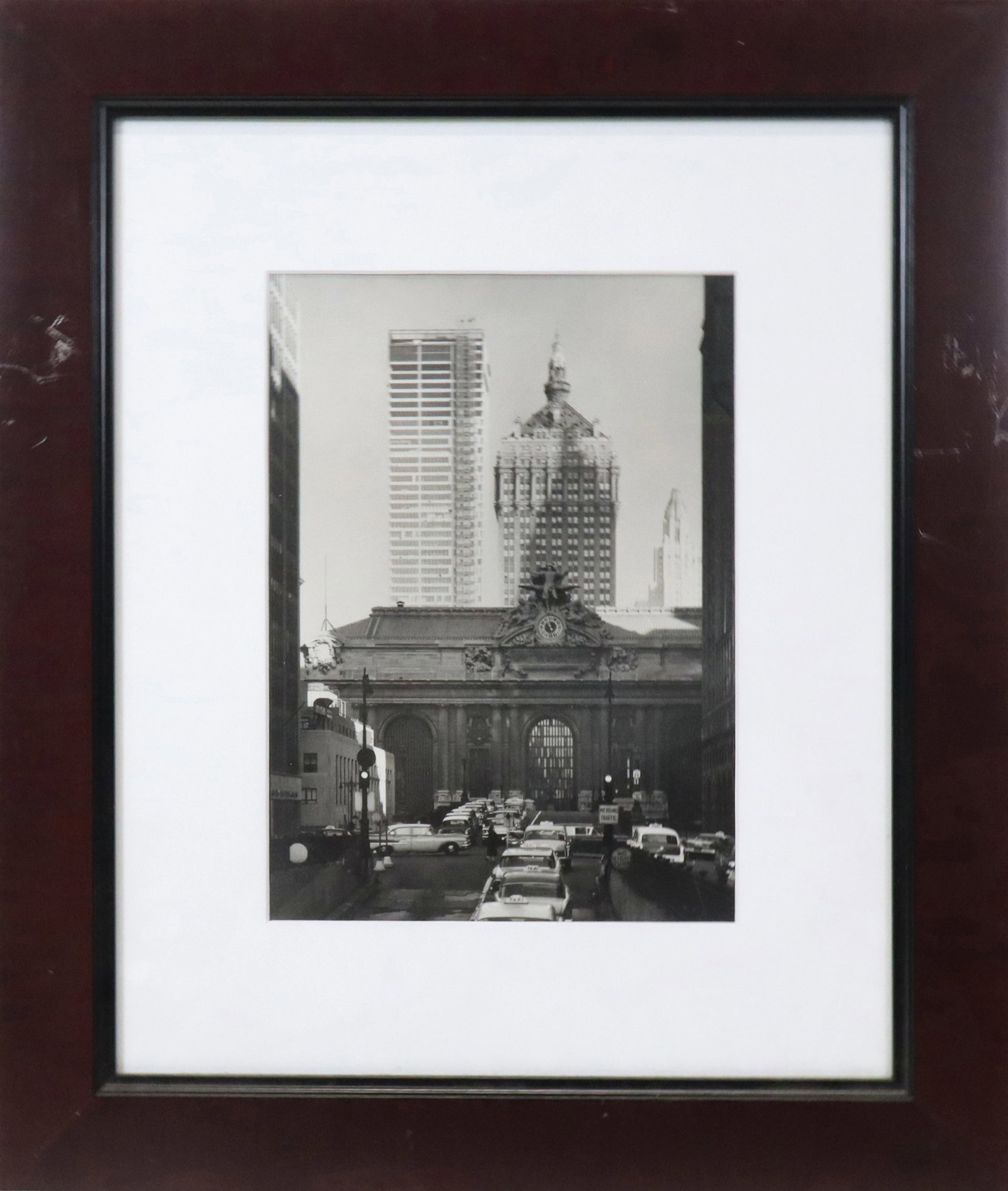 Vintage Photo Print of Grand Central Station: Vintage Photo Print of Grand Central Station, coming from Park avenue in the 30's. Scene is circa 1950's, unsigned. [Sight 13" H x 9" W; frame 23" H x 20" W]. Fine condition, frame scratched, not remo