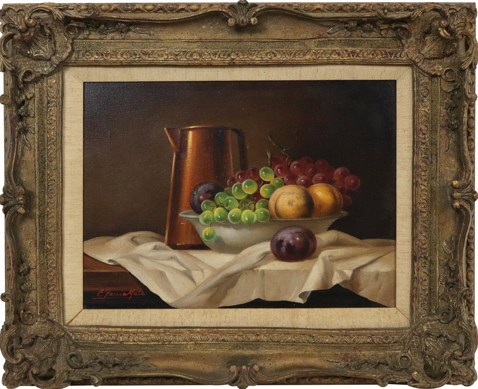 Evelio Garcia MATA Oil on Canvas Table Still Life: Evelio Garcia Mata (Cuban/French, 1910-1985) oil on canvas table still life with pitcher and bowl of fruit, signed lower left "E Garcia Mata", contained in carved frame, bearing label to verso. [Canva