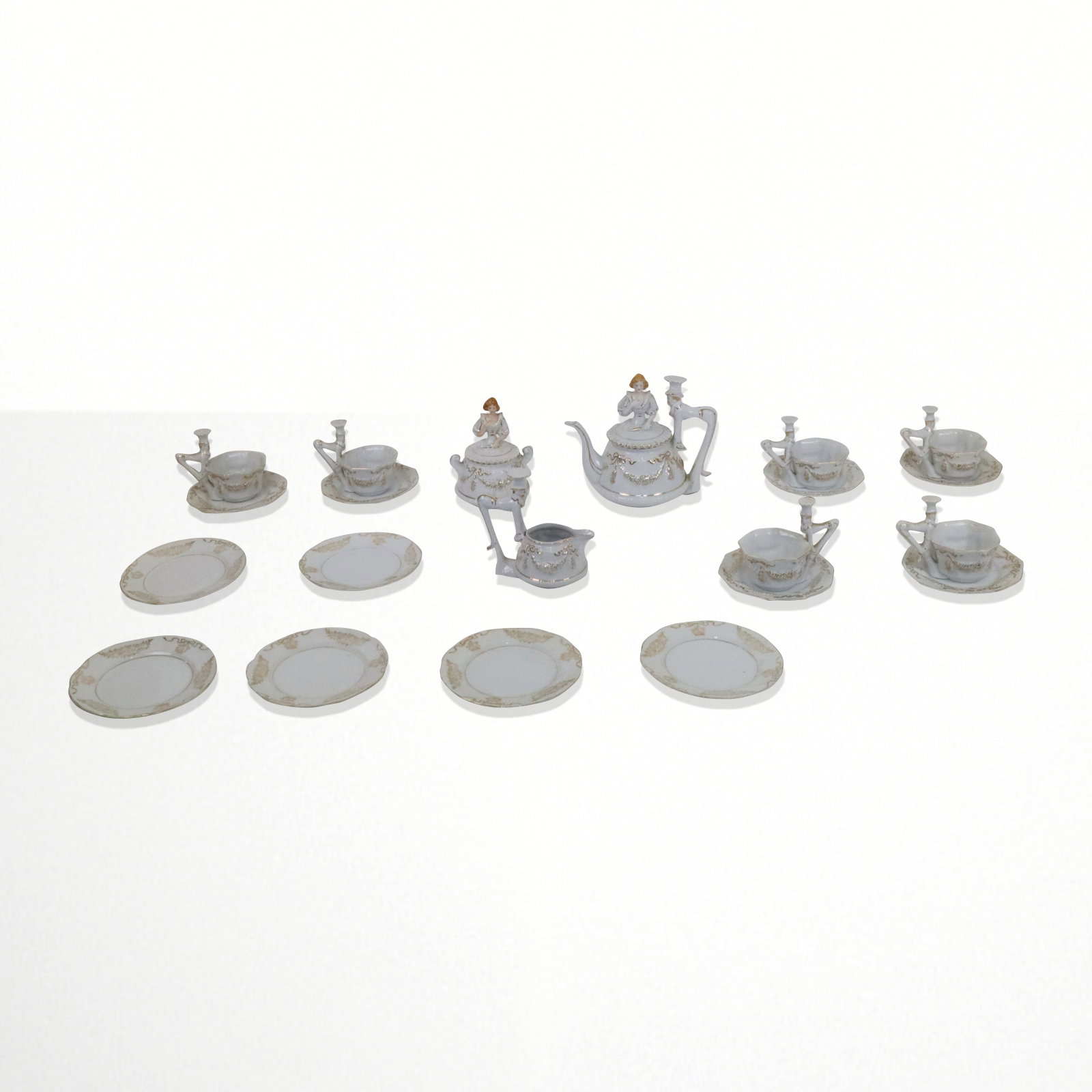 Japanese MEPOCO Dessert Set, 21: Japanese MEPOCO dessert set, comprising 6 plates, 6 saucers, 6 cups, teapot, creamer, covered sugar, covers with female figure finials, handles of men in top hats, unusual and collectable. Vintage mid