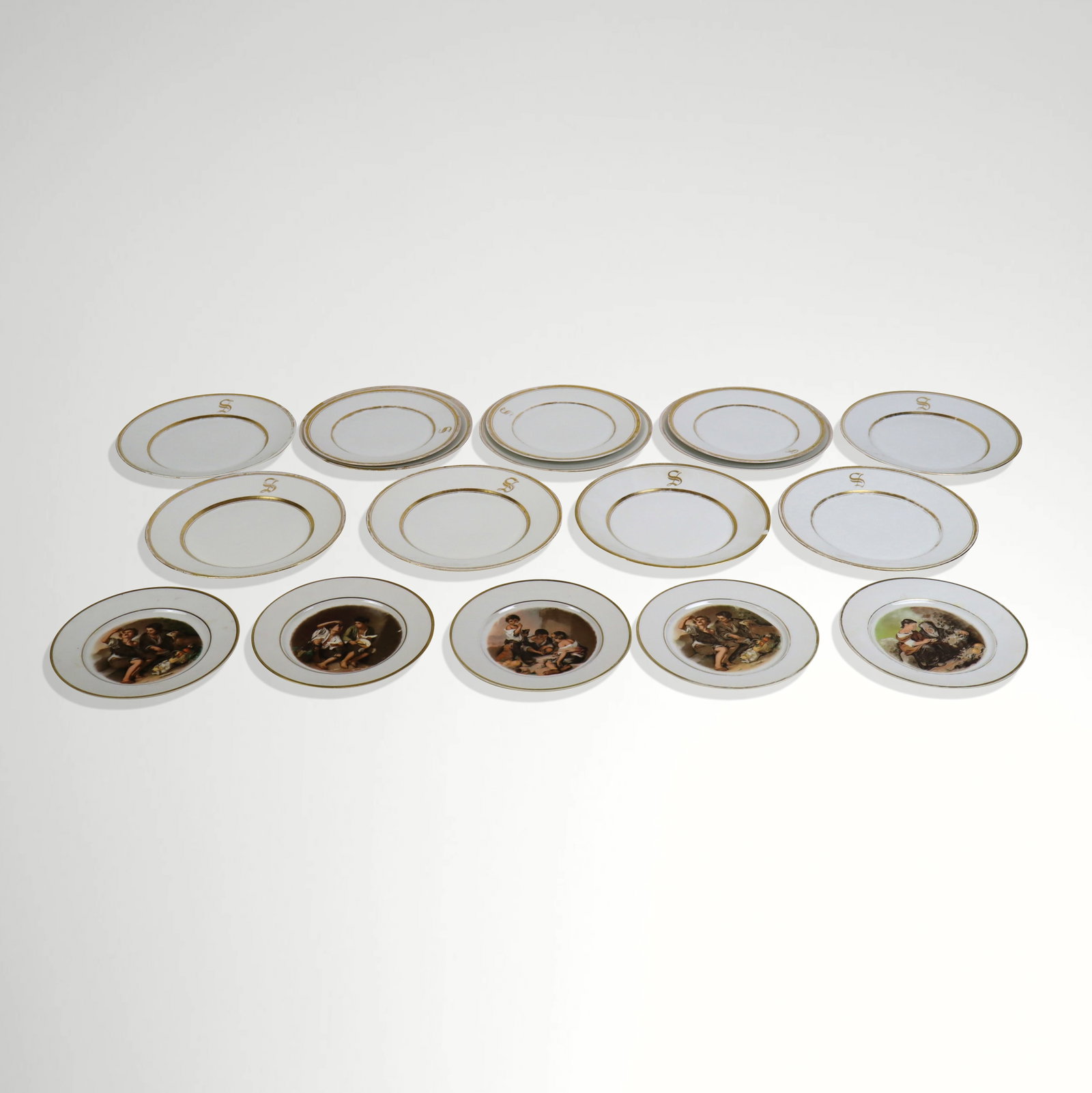 Collection of Gilt Decorated Plates, 17: Collection of assorted gilt decorated plates, comprising 9 Tressemanes & Vogt plates bearing a monogram S [9.5" Diameter], 3 William Gu?rin & Cie salad plates monogramed S [8.5" Diameter], and 5 trans