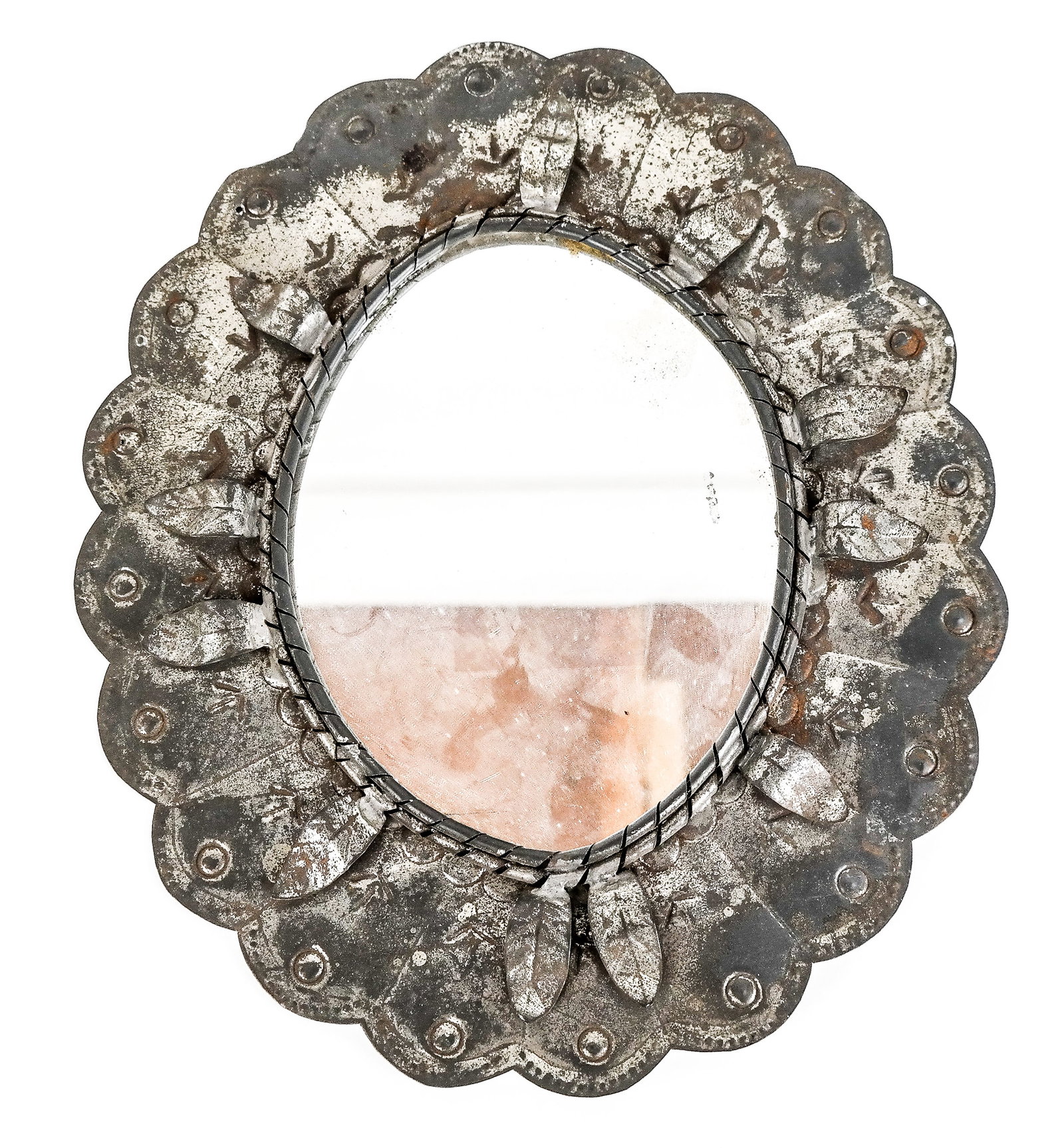 Small Mexican Tin Oval Mirror: Small Mexican folk art-style tin oval mirror with scallop edge. [Overall: 11" H x 10" W, Area of reflection: 6.5" H x 5" W]. From the Collection of Susan and Cliff Freeman.