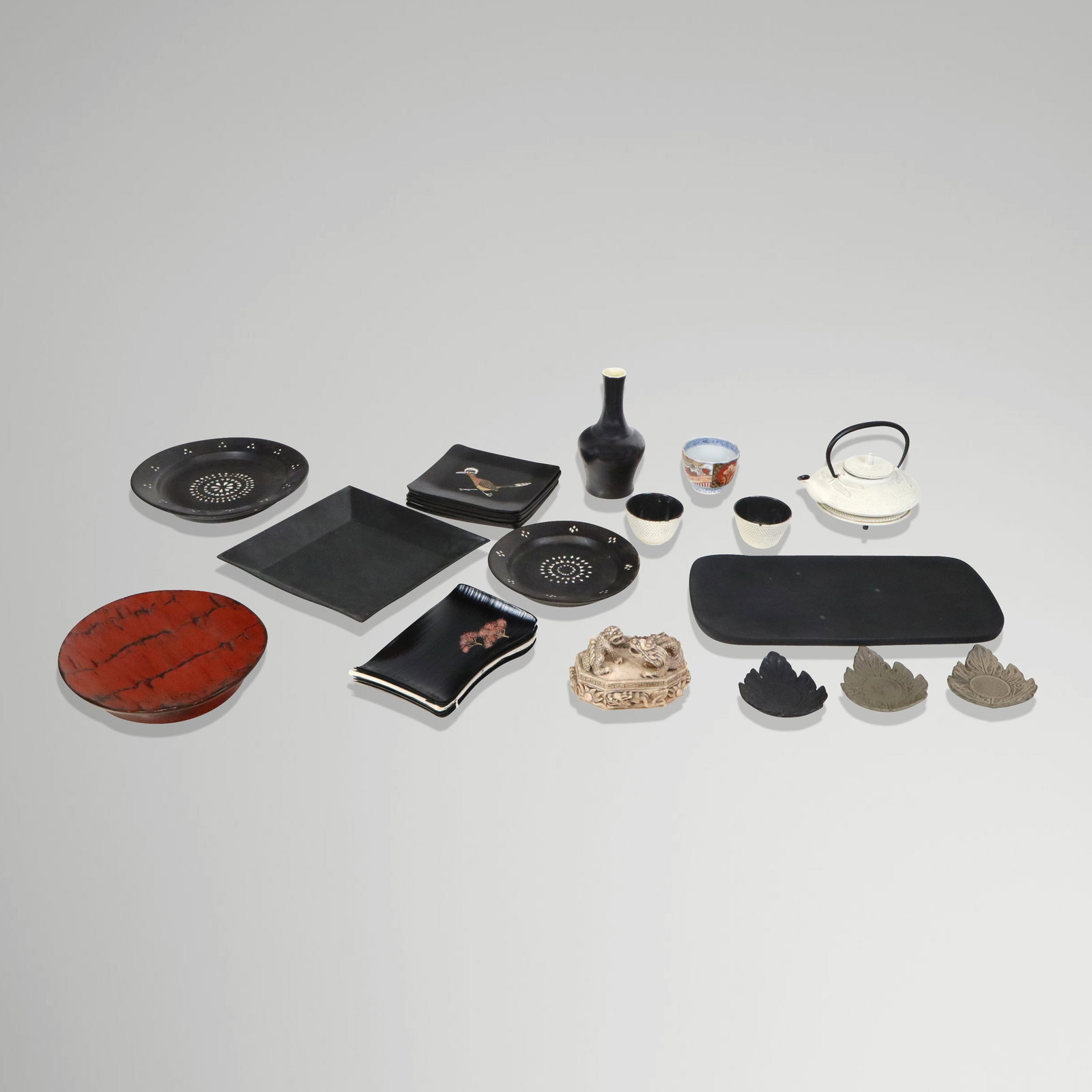 Group of Japanese Related Table Articles, 27+: Group of assorted lacquer and ceramic Japanese and other table accessories, comprising a dragonfly teapot and stand, two related tea cups with three leaf related saucers, seven cherry blossom lacquere