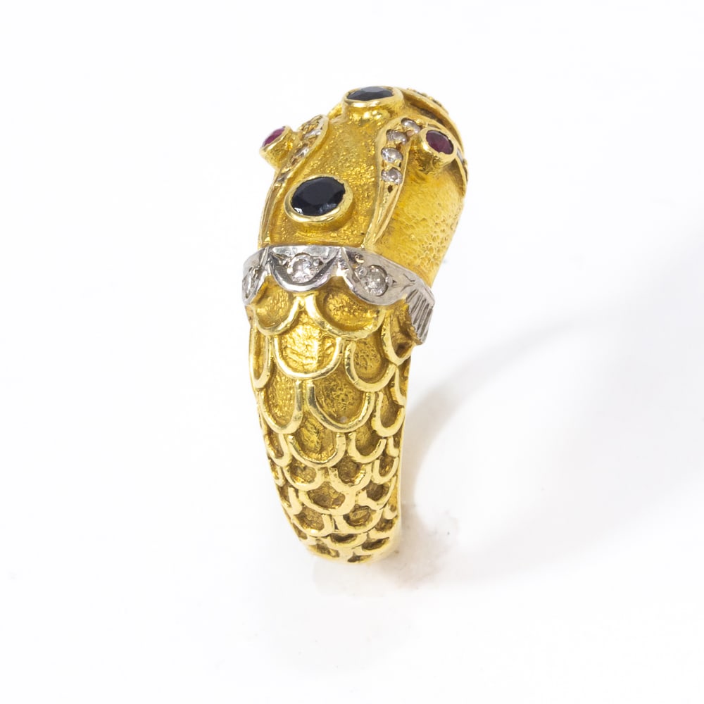 Lalaounis Manner Gold & Gemset Snake Ring: Lalaounis manner gold, ruby, sapphire and diamond snake ring, bearing plaque in the interior marked ? 750 and stamped on the exterior of the shank. [7.50 dwt., Adjustable slightly, ring size: 5.5]. Ov
