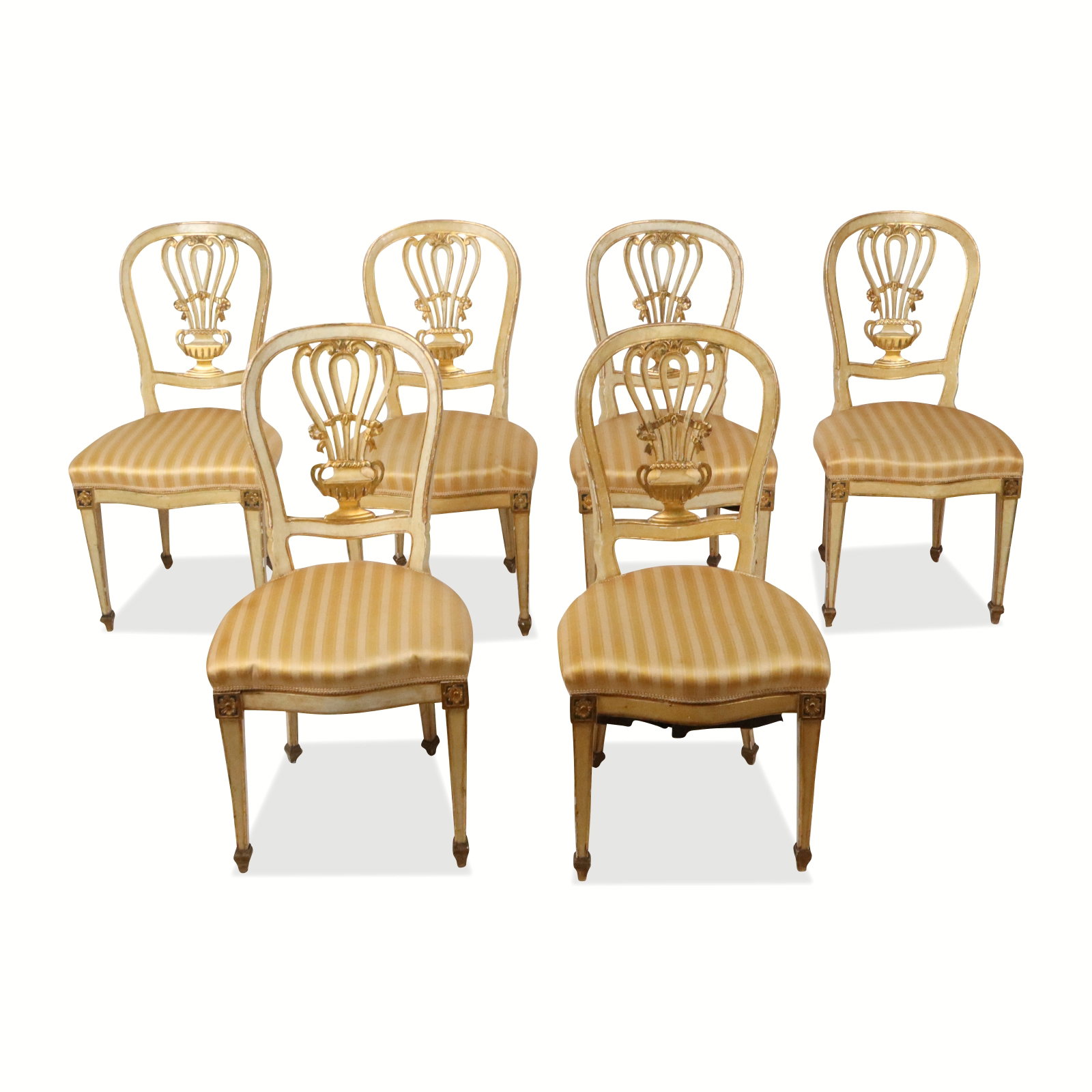 Louis XVI Carved and Gilt Side Chairs, 6: Six Louis XVI carved and gilt side chairs, early 20th century, with upholstered seats and urn decoration to backrests, made in Italy. [35" H x 20" W x 19" D; seat height: 19.5"]. Condition is good wit