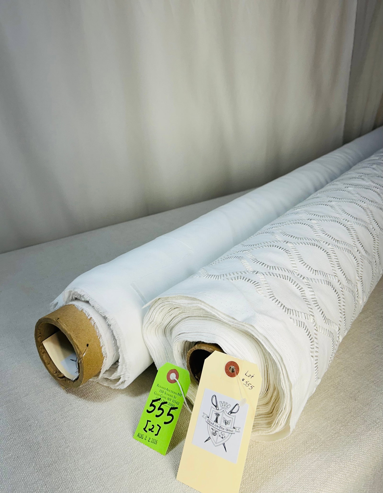Embroidered White Linen & White Crepe Sheer Fabric: 1) 21 beautiful yards of white and silver embroidery in a chain-link geometric on an elegant white linen ground, 54" width. The Indian textile is best for windows or beds. Has a 3" vertical repeat by 
