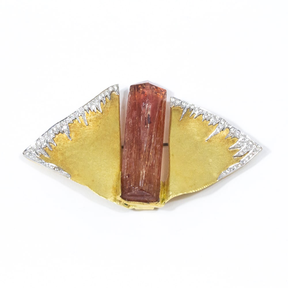 Wagner Topaz, Diamond & Gold Pin Pendant: Wagner topaz crystal, diamond and bicolored gold pendant brooch, probably circa 1970s, designed as a stylized moth, the textured yellow gold wings fringed with diamonds in white gold and centering a p