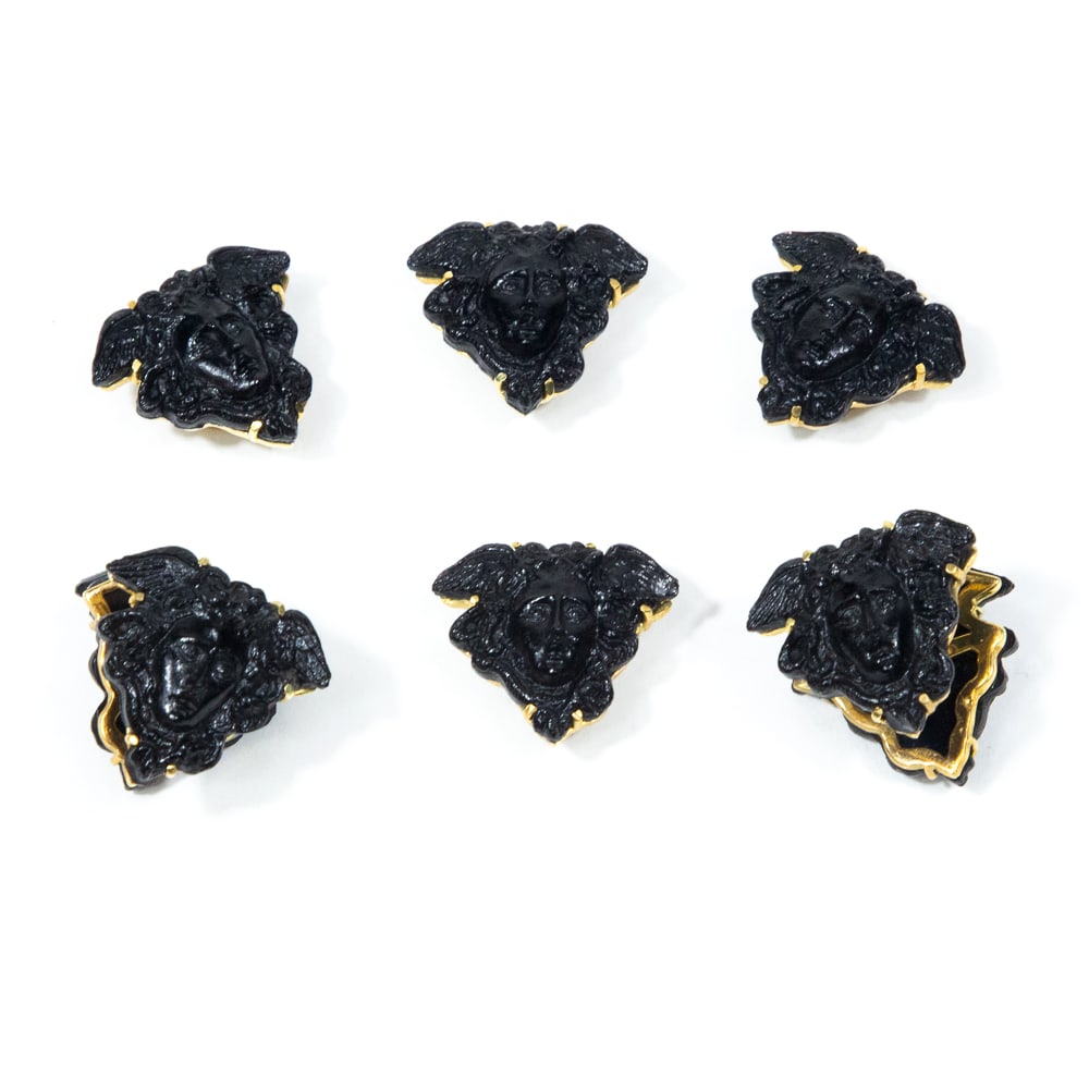 Medusa Molded Glass & Gold Dress Set, 6: Medusa black molded glass and yellow gold gents dress set, comprising a pair of double locking cufflinks and four shirt studs, marked 14K on tongue of cufflinks. [1" Square]. Overall condition is good