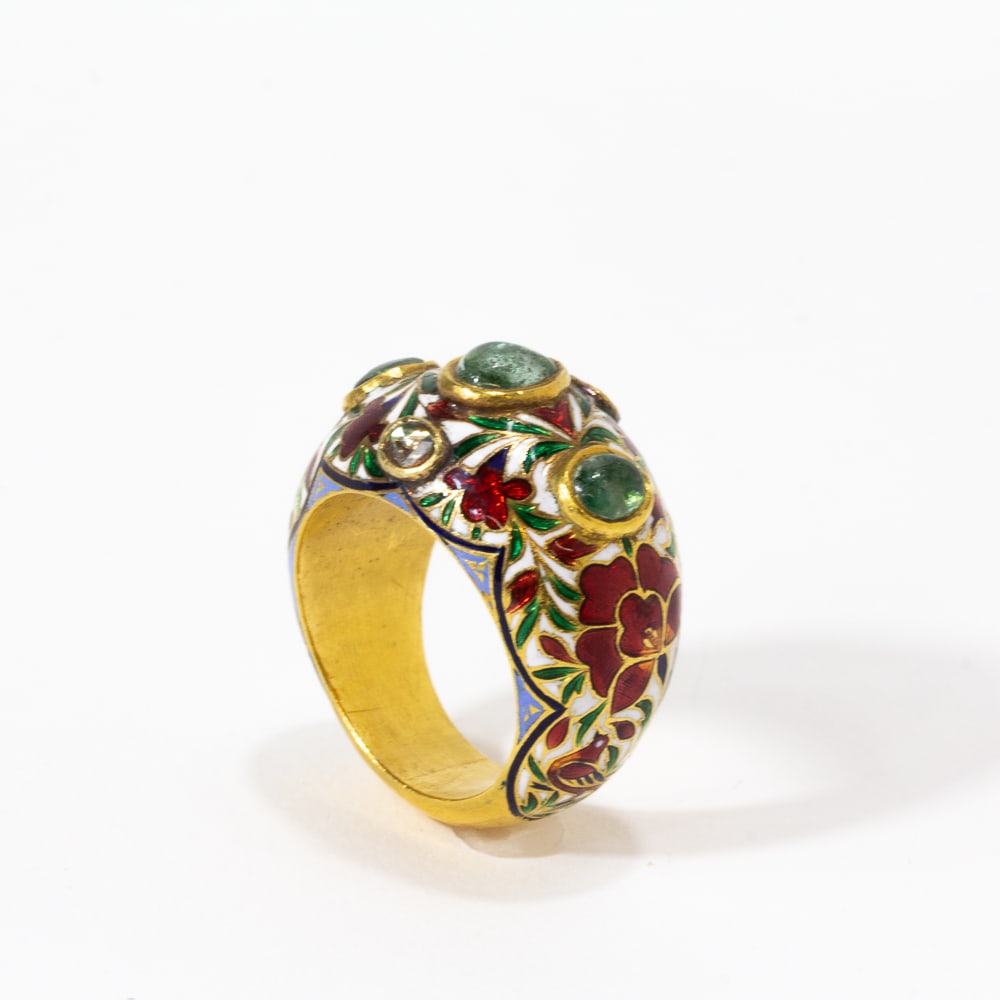 Mughal Inspired Enamel & Gilded Metal Ring: Mughal inspired enamel decorated gilded metal ring set with two table-cut diamonds, and three collet-set cabochons, unmarked. [Ring size: 10.75]. Overall condition is good, some scratches to interior 