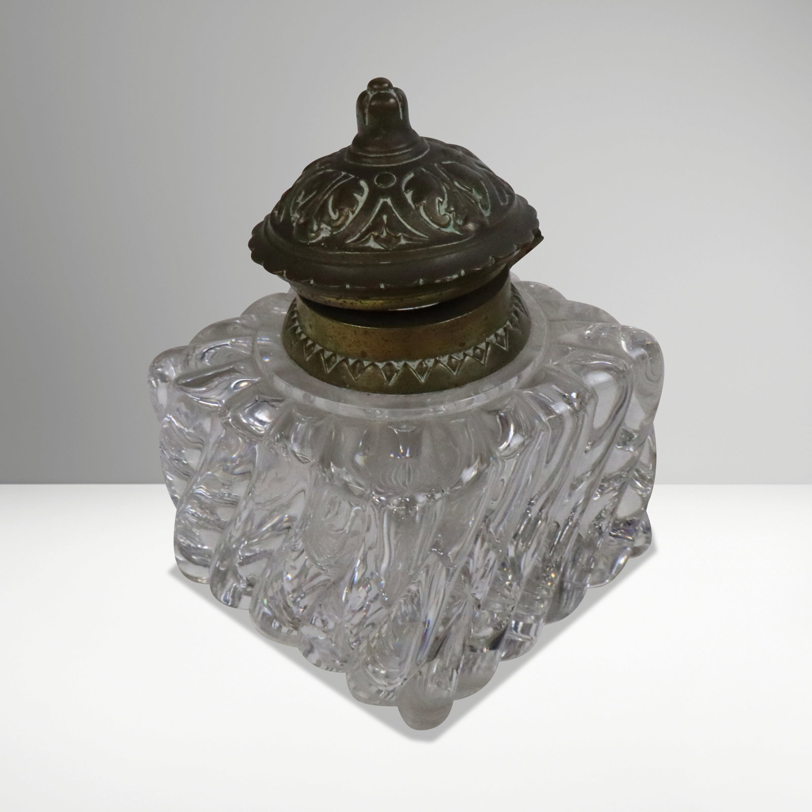 Baccarat Crystal & Gilt Bronze Inkwell: Baccarat crystal and gilt bronze inkwell, French, 19th century, unmarked except interior cap "2 X". [4" H x 3" Square]. Overall condition is good, loss of gilt to top.