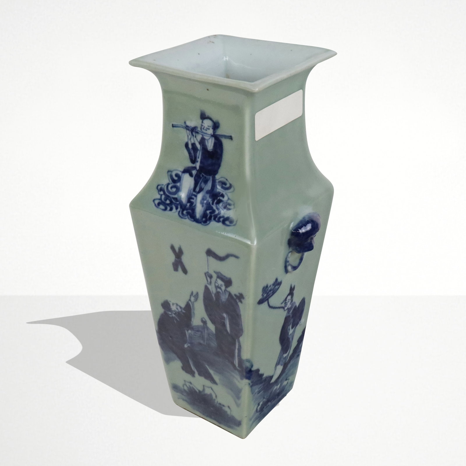 Chinese Celadon and Blue Decorated Vase: Chinese baluster vase, 19th century, with a celadon ground and blue figural and landscape decoration and two foo dog handles, unmarked. [15.75" H x 7" W x 6" D]. Condition is good.