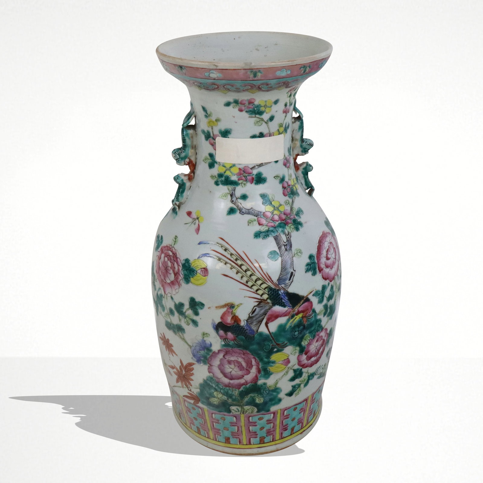 Chinese Famille Rose Porcelain Vase: Chinese Famille Rose porcelain vase, Qing Dynasty, circa 19th century, with hand-painted floral and phoenix decoration, and two double foo dog handles, unmarked. [17.5" H x 9" Diameter]. Condition to 