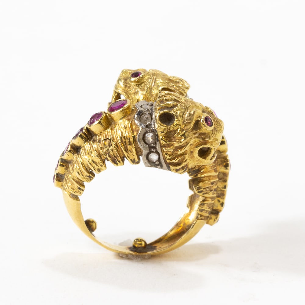 Lalaounis Gold & Gem-Set Chimera Ring: Lalaounis bicolored gold, ruby, and diamond chimera passerby ring, of classic design, the interior bearinng a plaque Lalaounis 750 with makers mark. [10.25 dwt., Ring size 5]. Overall condition is goo