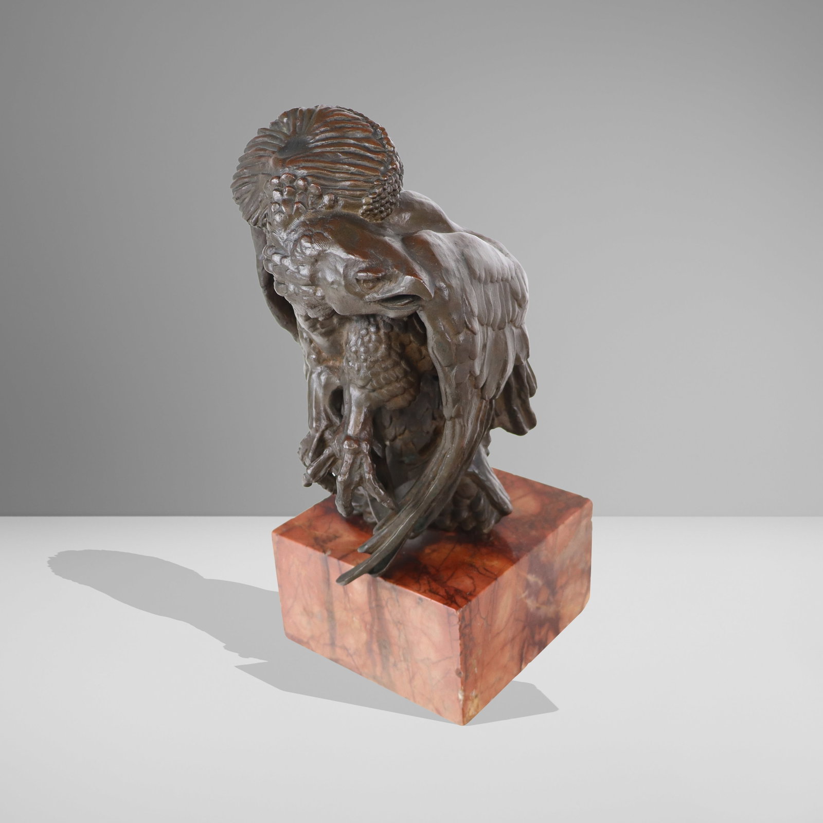 Bronze Figure of an Eagle: Bronze figure of eagle with outstretched talons and looking left, resting on a marble base, unsigned. [12.5" H x 5.5" W x 6.5" D]. Overall condition is good, with abrasion and small chips along corner