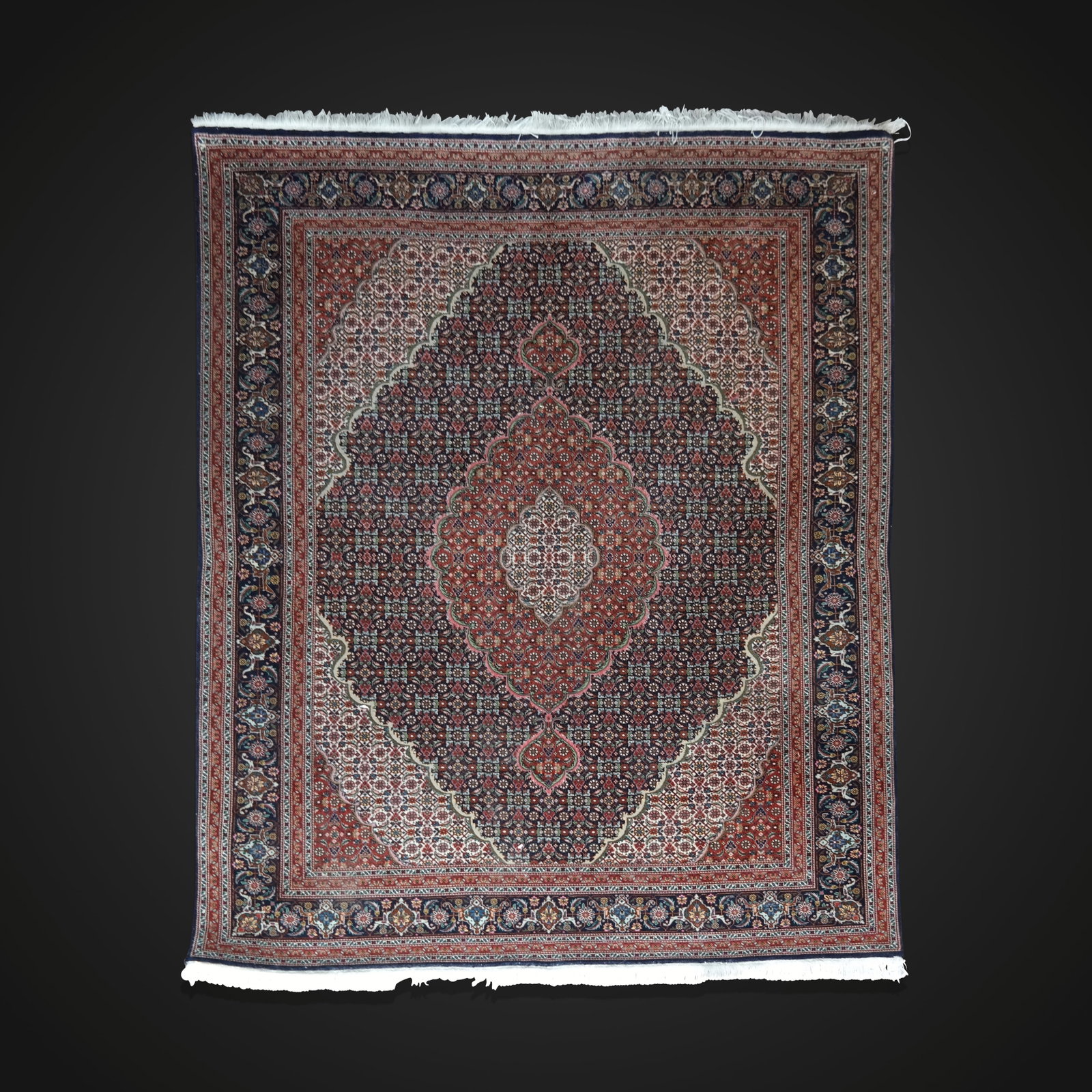 Oriental Rug, India, Late 20th Century: Oriental rug, India, late 20th century, all-over intricate and very fine colorful pattern with a medallion center and dark border. [4' 11" x 6' 2"]. Fine condition.