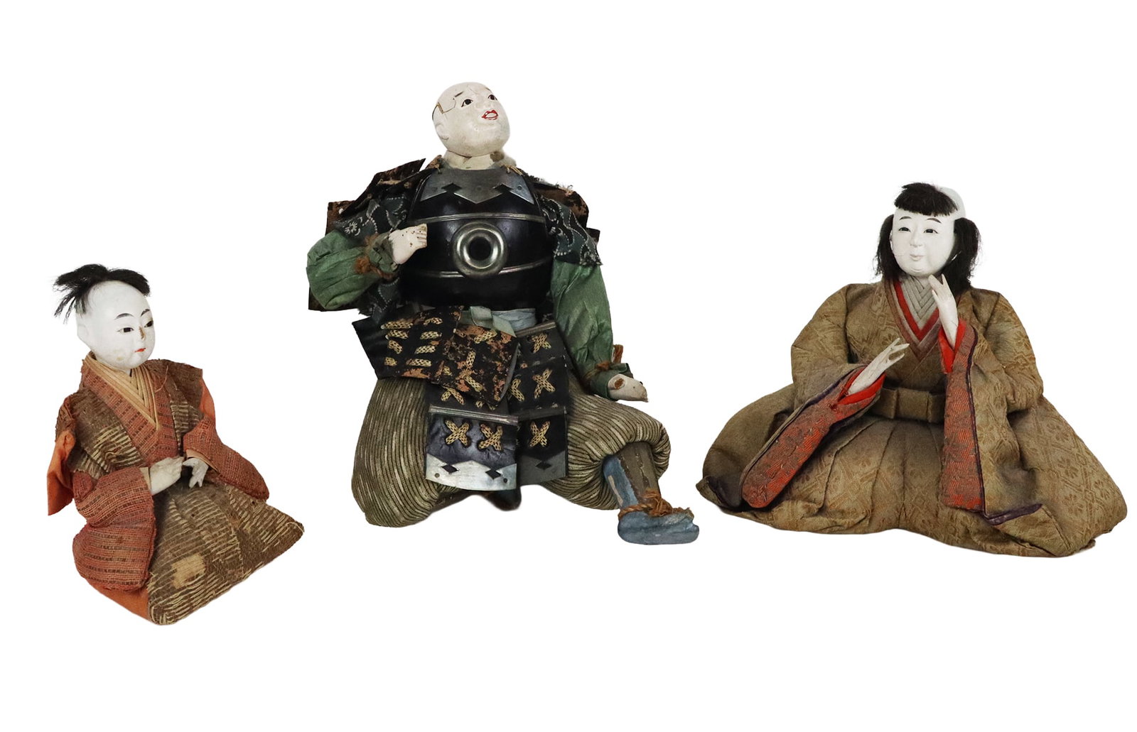 Three Meiji Period Japanese Ningyo: Three Japanese ningyo, Late Edo to early Meiji period, circa mid-19th century, all with gofun lacquered finish to head and arms, and adorned in silk robes with paper accent to collar smaller two with 
