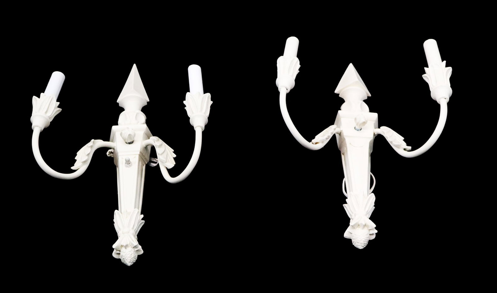 Pair Carved Contemporary Painted Palm Leaf Sconces: Pair of carved contemporary painted palm leaf sconces with obelisks tops. [20" H x 12" W]. Good condition. LOCATED AT 150