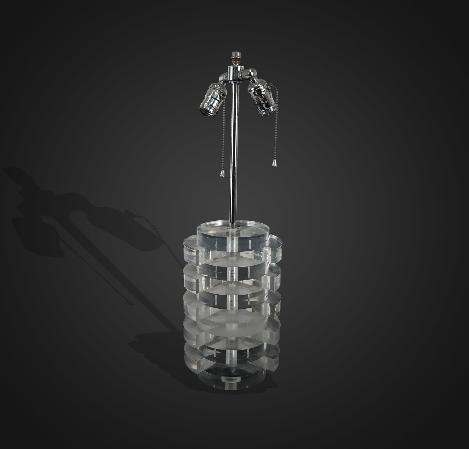 Modern Lucite Openwork Column Lamp: Modern Lucite openwork column lamp, 1970's, round discs with quarter moon dividers in column form. [22" H to finial x 7" x 5.5"]. Very good condition.