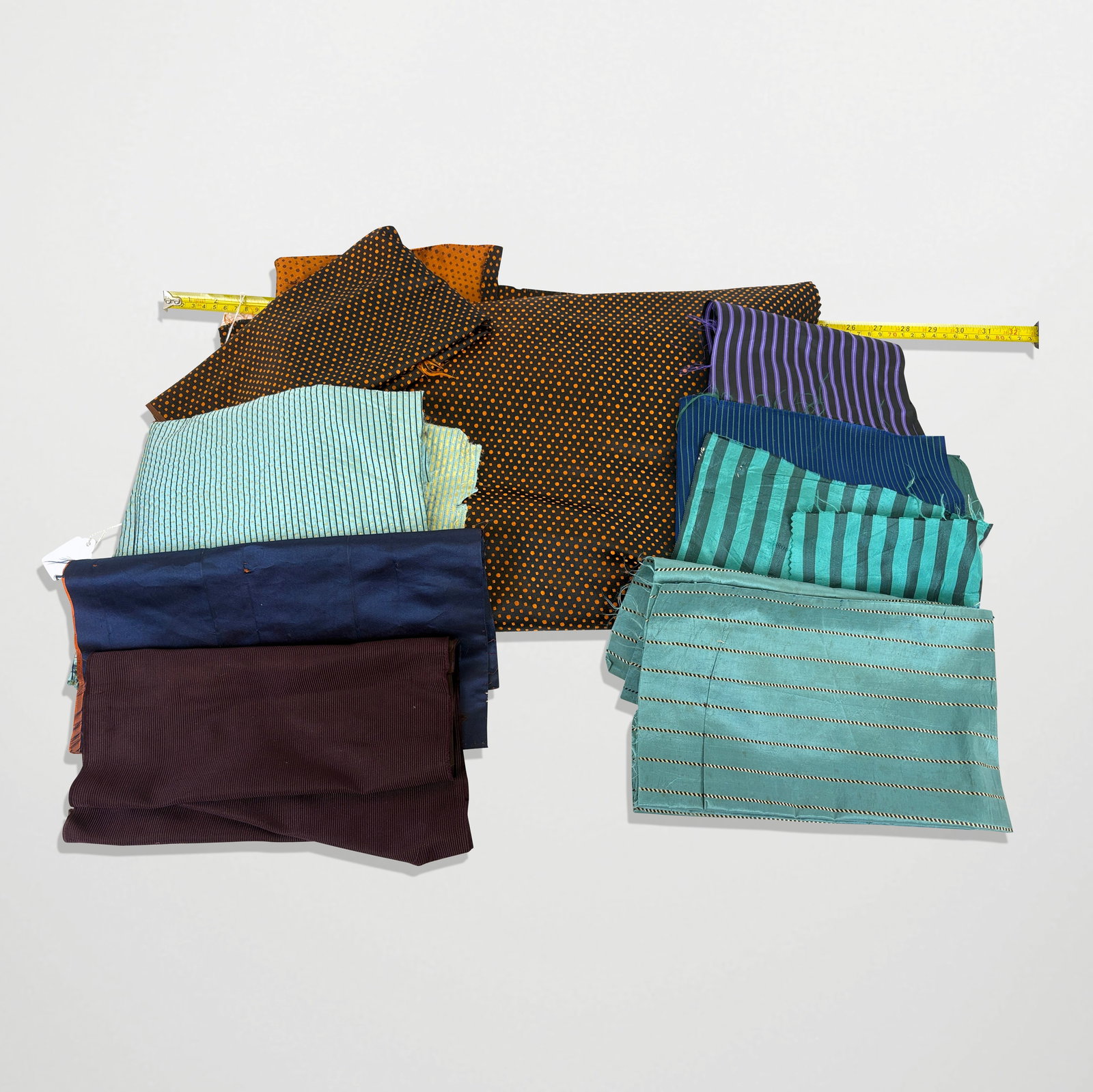 American Silk Fragments: Fragments; 19th and 20th century, very colorful, solids, stripes and polka dots. Some stains, per age. Property sold on behalf of the Brooklyn Museum.