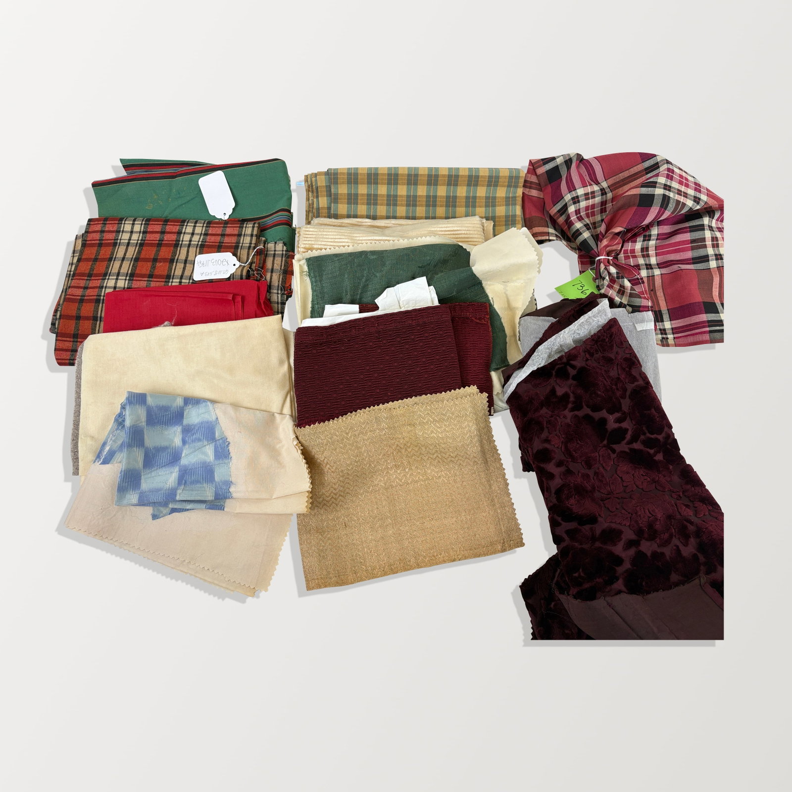 American Silk Print and Cut Velvet Fragments: Fragments; 19th and 20th century; Plaids, pile, striped, purple floral, and more. Some age spots, stains, tattered edges. Property sold on behalf of the Brooklyn Museum.