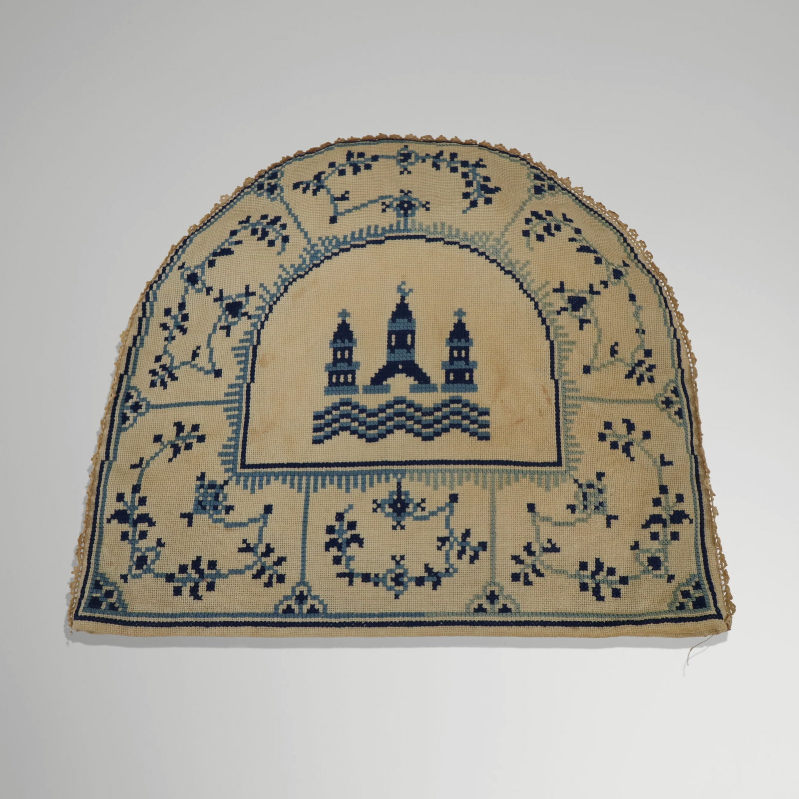 19th Century Danish Tea Cozy: Tea cozy; needlepoint on fabric in blues on white, center towers and trim, double sided. [12" x 15"]. Age stains. Property sold on behalf of the Brooklyn Museum.