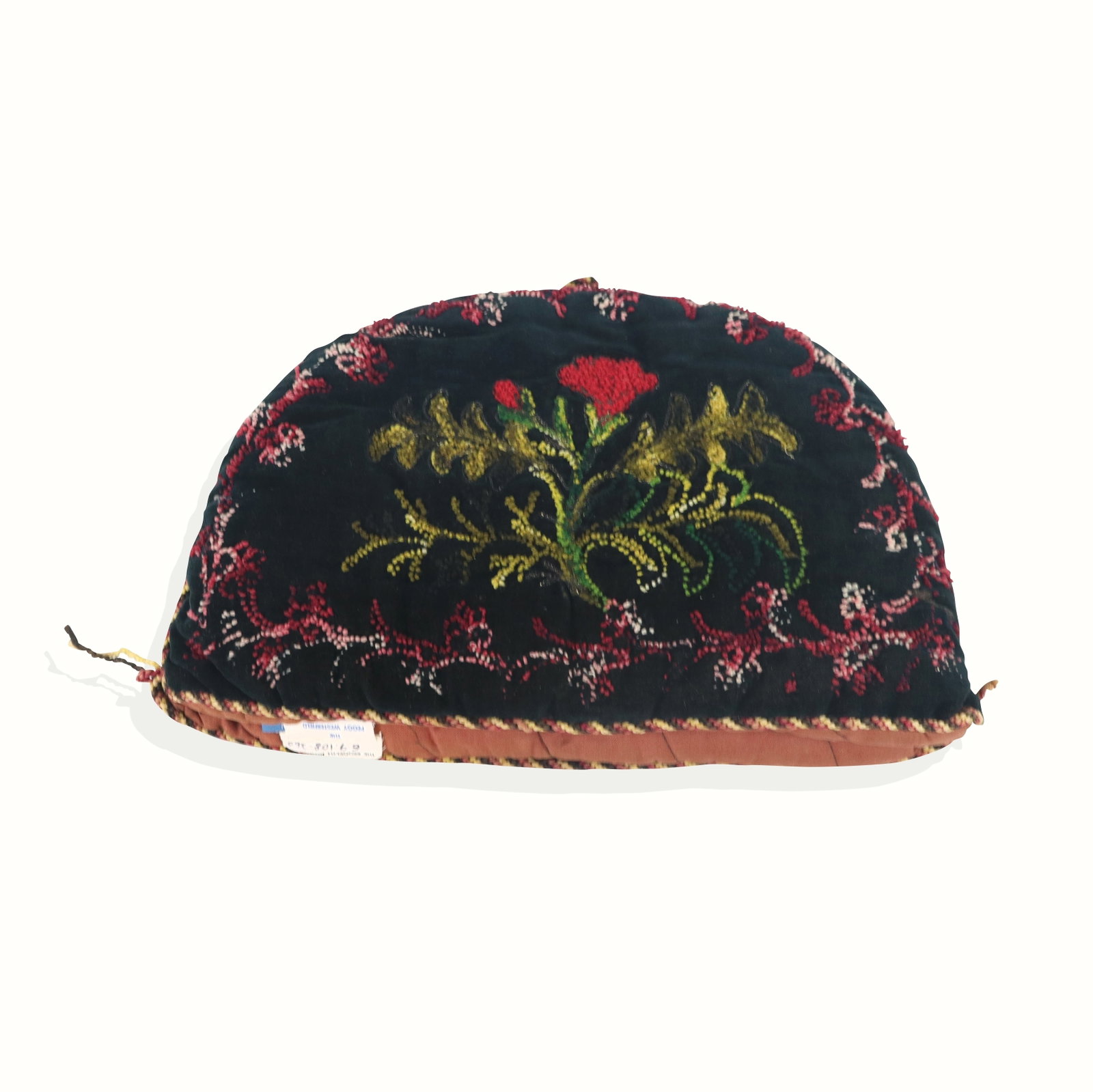 19th Century American Tea Cozy: Tea cozy; needlepoint on velvet in flowers with colorful trim. [10" x 15"]. Fraying edges. Property sold on behalf of the Brooklyn Museum.