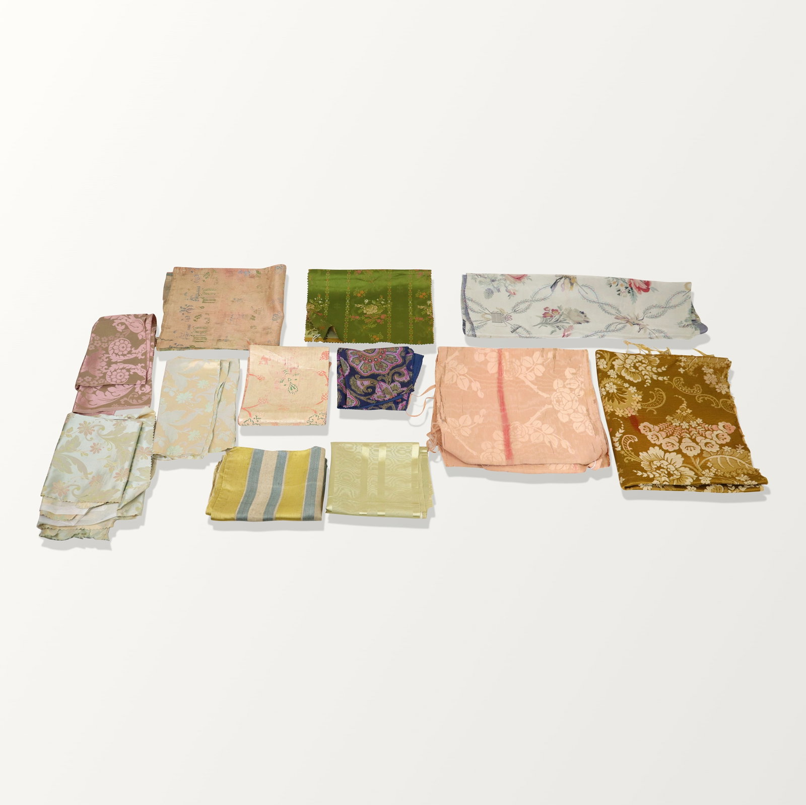 French Silk Brocade Fabrics and Fragments: Fabric and fragments, 18th and 19th century, Including an American jacquard, prints, floral, solids and stripes. Fair condition, some aging and wear. Property sold on behalf of the Brooklyn Museum.
