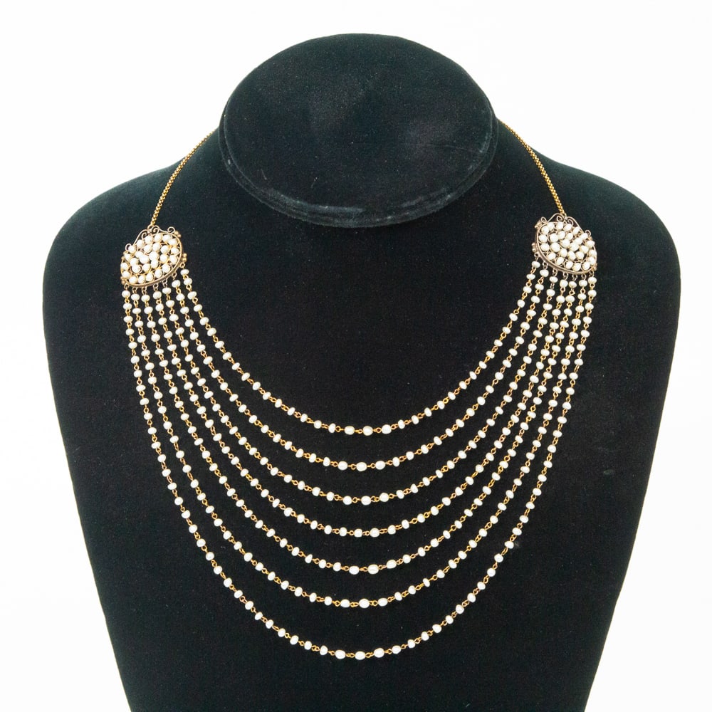 Antique Seed Pearl & Gold Drapery Necklace: Antique seven strand seed pearl and gold necklace, probably Italian, circa 1900, daintly designed with seven graduating strands ot tiny seed pearls joined by circular pendants and attached to a fine l