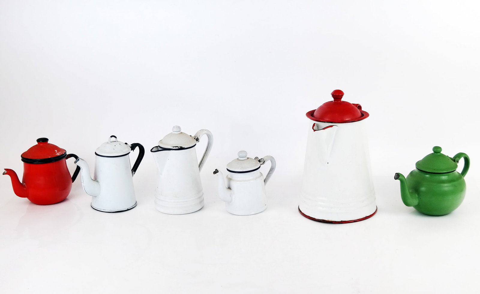 Vintage Enamel and Metal Coffee & Teapots: Painted enamel and metal coffee and teapots in red, white and green, one marked to base "Japan Asahi". [Tallest: 9" H x 7" W]. All worn. Condition reports and requests for additional photos cannot be 