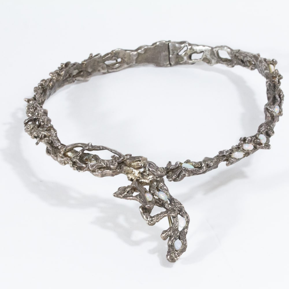 Ailene Fields Silver & Opal Necklace: Ailene Fields sterling silver and opal hinged collar, marked AF. [6.05 ozt., 16.5" L]. Overall condition is good, tests for sterling silver, one opal deficient. From the esteemed collection of Neil Zu