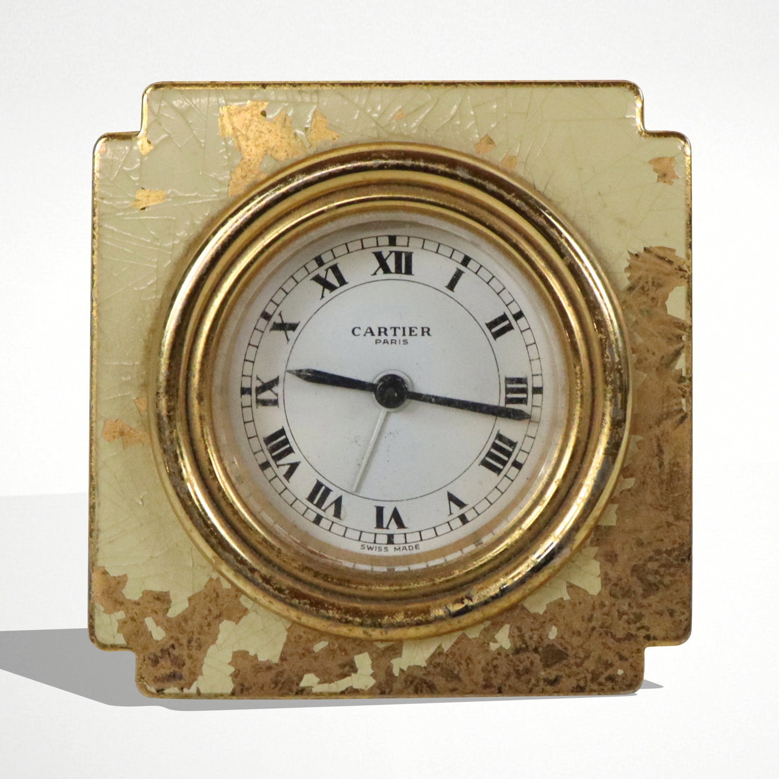 Cartier Brass & Enamel Travel Clock: Cartier brass and enamel easel back desk / travel clock, signed Cartier on the dial and back of case. [3" Square]. Overall condition is poor, significant loss to enamel, left C fragment missing off ea