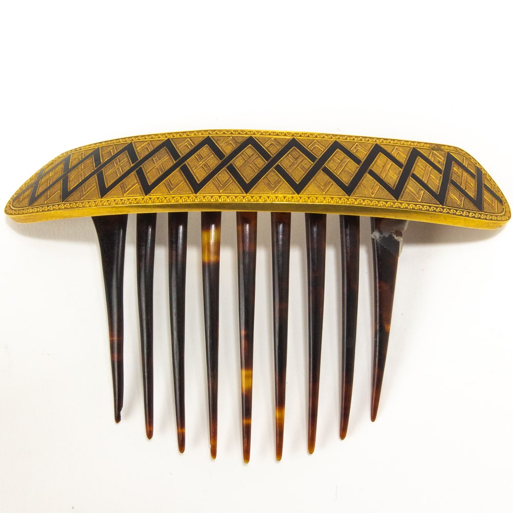 Antique Gold & Enamel Hair Comb: Antique 18 karat gold and black enamel hair comb, French, late 19th century, the shaped crest with zig-zag motif, with French assay mark and illegible makers mark. [Total weight, inclusive: 26.4 dwt.;
