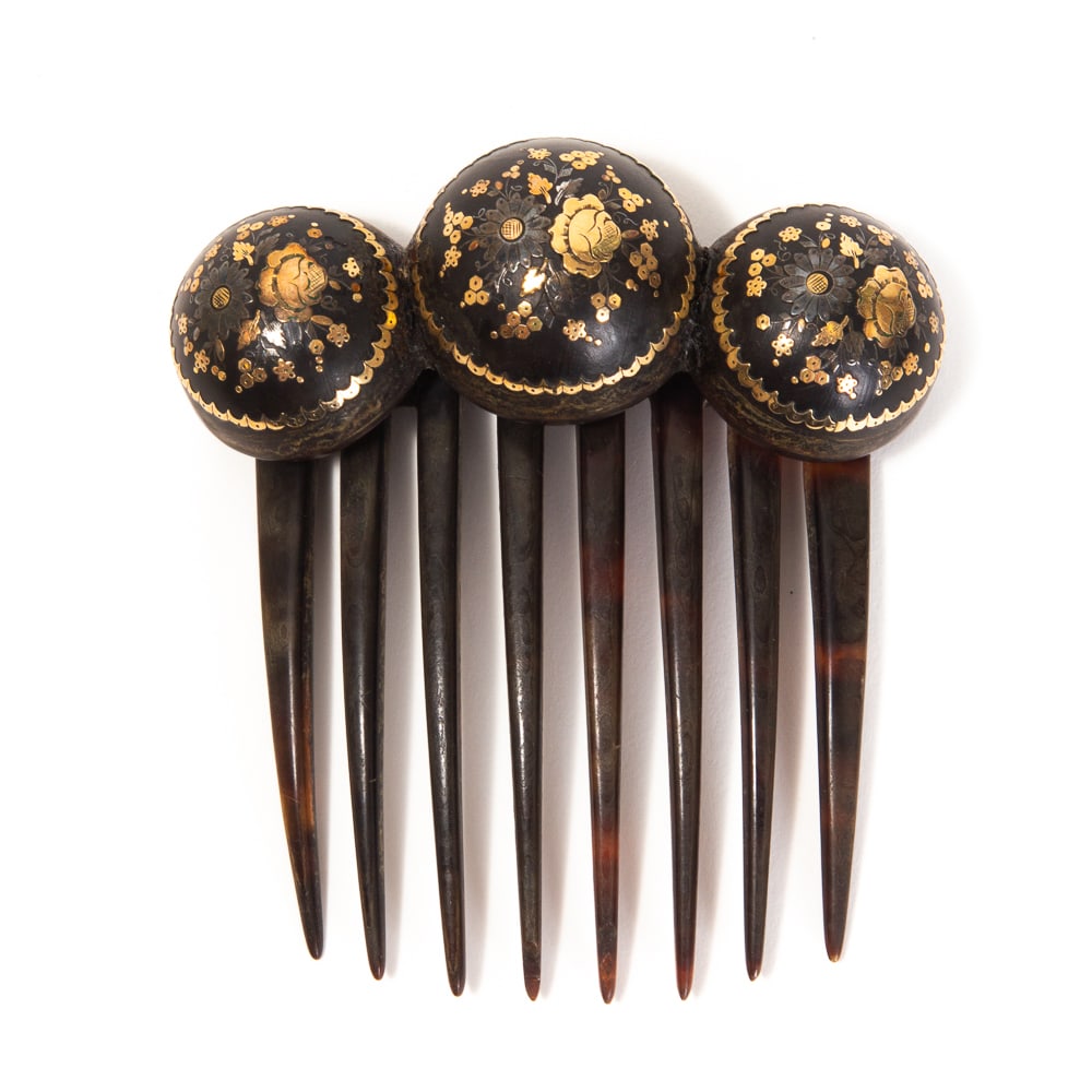 Victorian Pique Decorated Hinged Hair Comb: Victorian pique decorated hinged hair comb, likely French, mid-late 19th century, the hinged crest of three hemispheres and decorated with blooming bouquets of flowers and scalloped borders. [3.25" H 