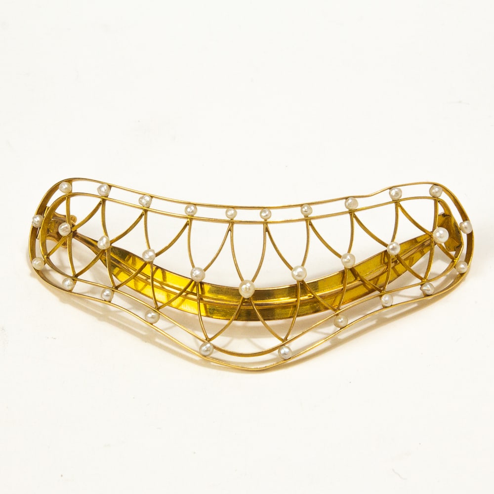 Victorian Gold & Seed Pearl Barrette: Victorian gold and pearl barrette, American, probably first half of 19th century, the crown outline defined by knife edge lines accented with seed pearls, marked to reverse 14k with makers mark. Prove