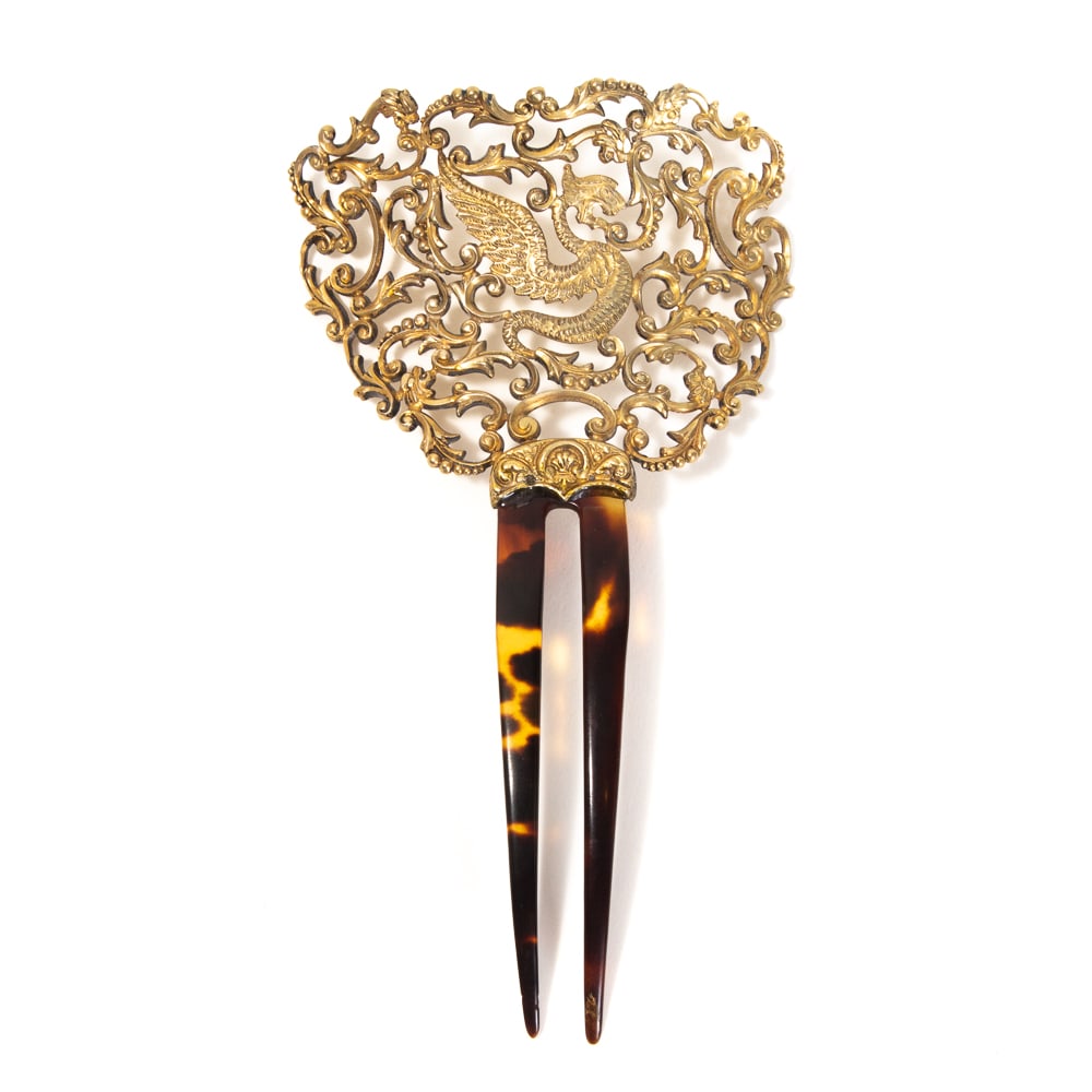 Antique Silver Vermeil Pierced Dragon Hair Comb: Antique sterling silver vermeil pierced dragon hair comb, early 20th century, the two tine comb mounted with a pierced medallion featuring scrolling foliate designs surrounding a dragon, marked "sterl