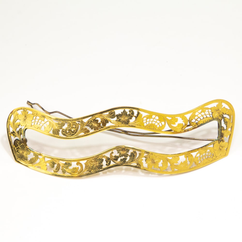 Art Nouveau Pierced Gold Floral Barrette: Art Nouveau pierced gold floral barrette, late 19th-early 20th century, the wavy band featuring floral and fruit motifs, bearing "M" mark, frame tests for 14 karat gold (clasp is metal). [Total weight