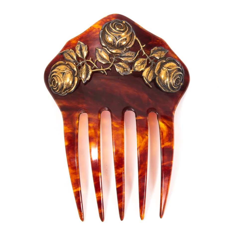 Art Nouveau German Silver Vermeil Hair Comb: Art Nouveau silver vermeil hair comb, German, late 19th-early 20th century, the arrow head crest accented with three rose buds, marked "830S" with additional mark to lower left rosebud. [5" H x 4" W].