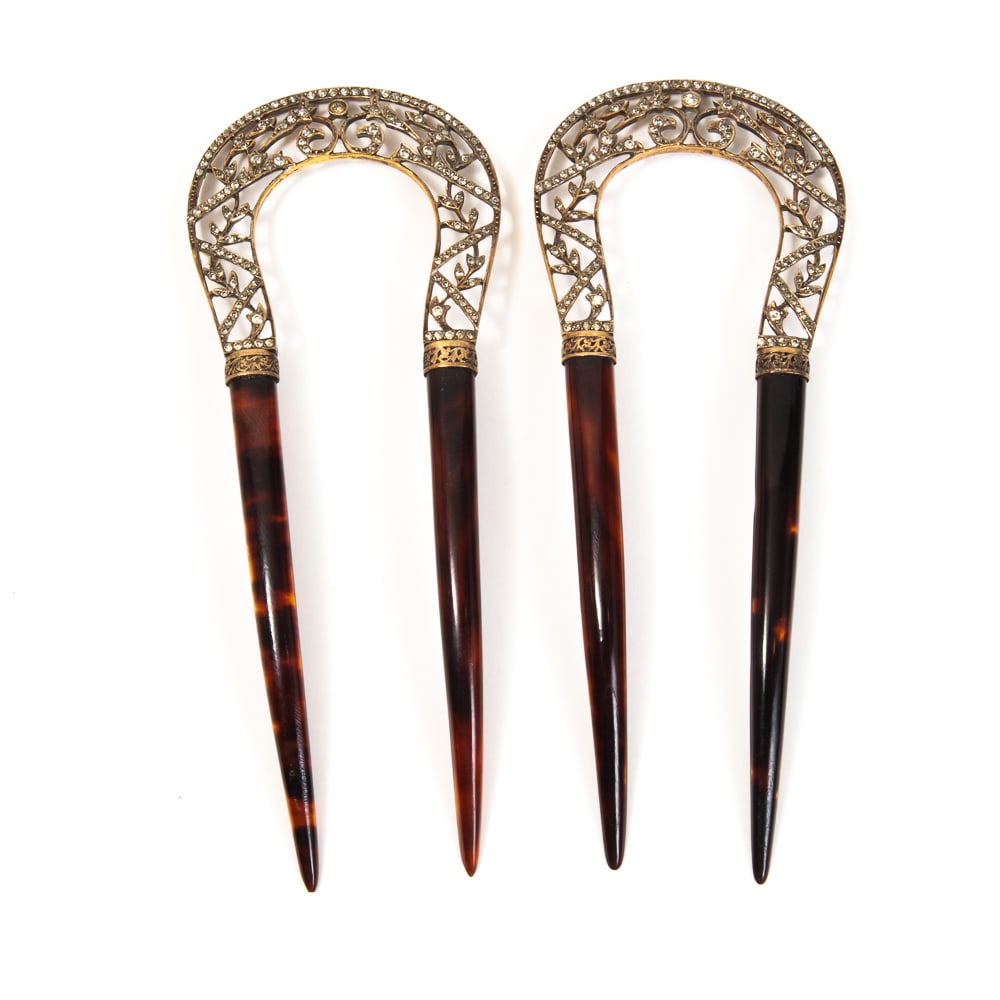 Antique Gold & Paste French Floral Hair Combs: Antique 18 karat gold and paste floral hair combs, French, probably late 19th century, the hinged horseshoe bands with pierced scrolling foliate motifs defined by paste stones, with illegible makers m