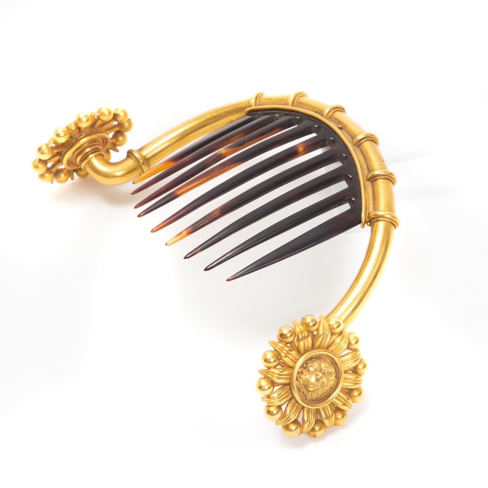 Victorian Brass Le Roi Soleil Hair Comb: Victorian brass le Roi Soleil hair comb, French, late 19th century, the arched framed with foliate terminals depicting the Louis XIV the Sun God. [4" H x 6" W]. Overall condition is good commensurate 